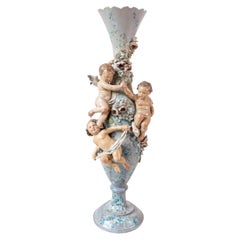 French 1870s Slender Majolica Vase with Floral Décor and High-Relief Cherubs