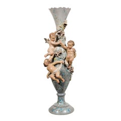 French 1870s Slender Majolica Vase with Floral Décor and High-Relief Cherubs
