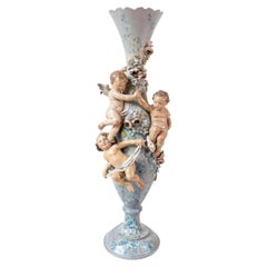 French 1870s Slender Majolica Vase with Floral Décor and High-Relief Cherubs