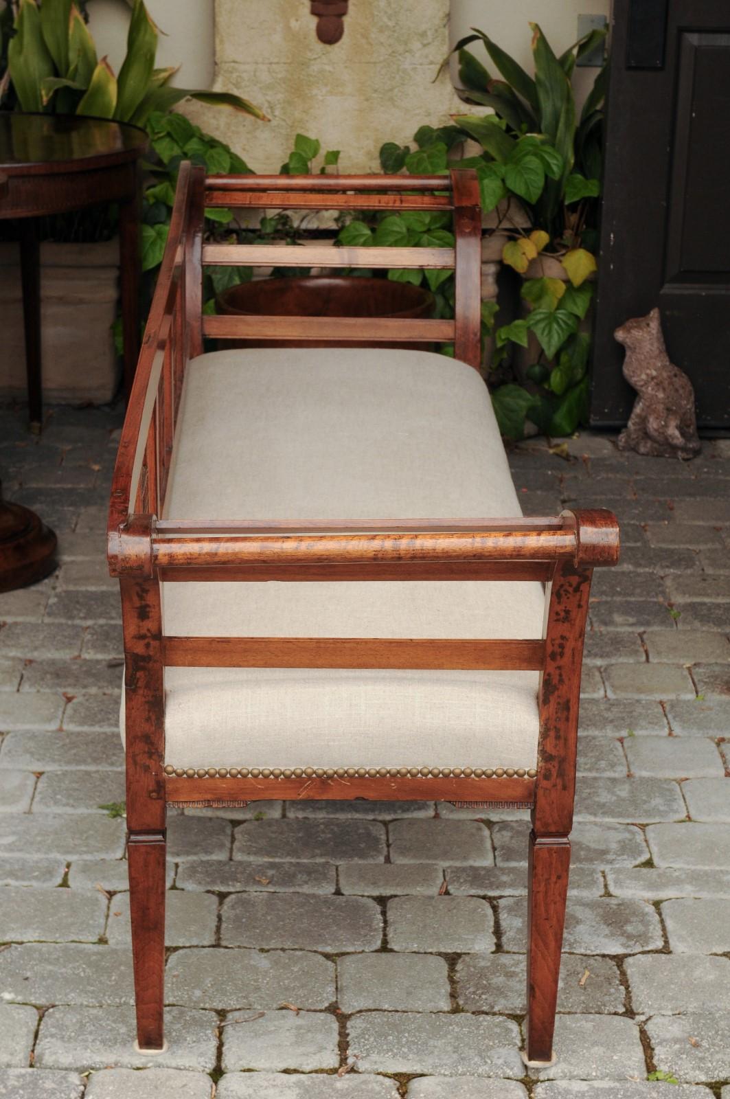 French 1870s Upholstered Fruitwood Settee with Carved Urns and Outscrolling Arms 6