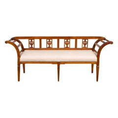 French 1870s Upholstered Fruitwood Settee with Carved Urns and Outscrolling Arms