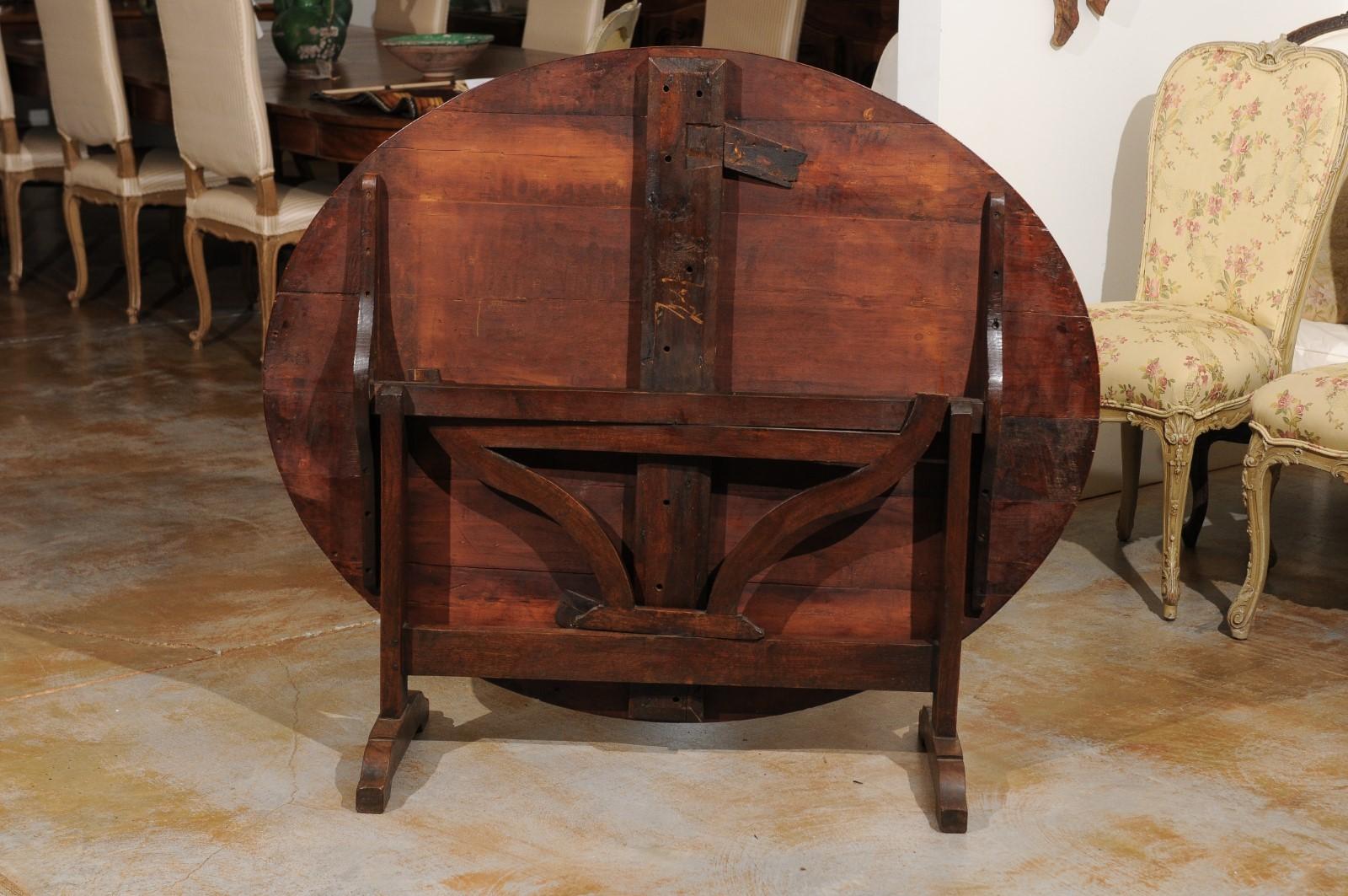 19th Century French 1870s Wine Tasting Table with Oval Tilt-Top, Trestle Base and Wedge