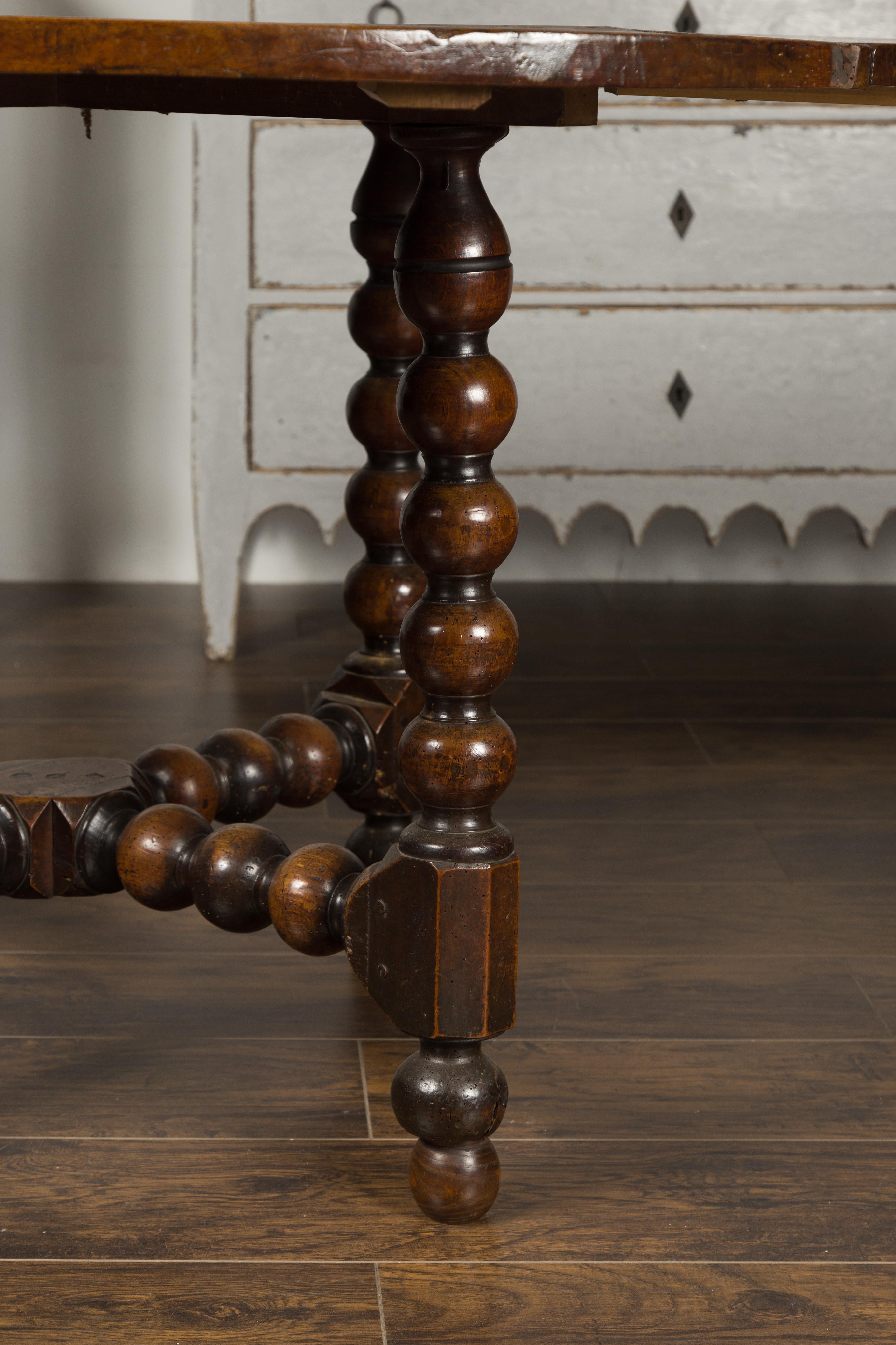 19th Century French 1880s Louis XIII Style Walnut Table with Bobbin Legs and Cross Stretcher