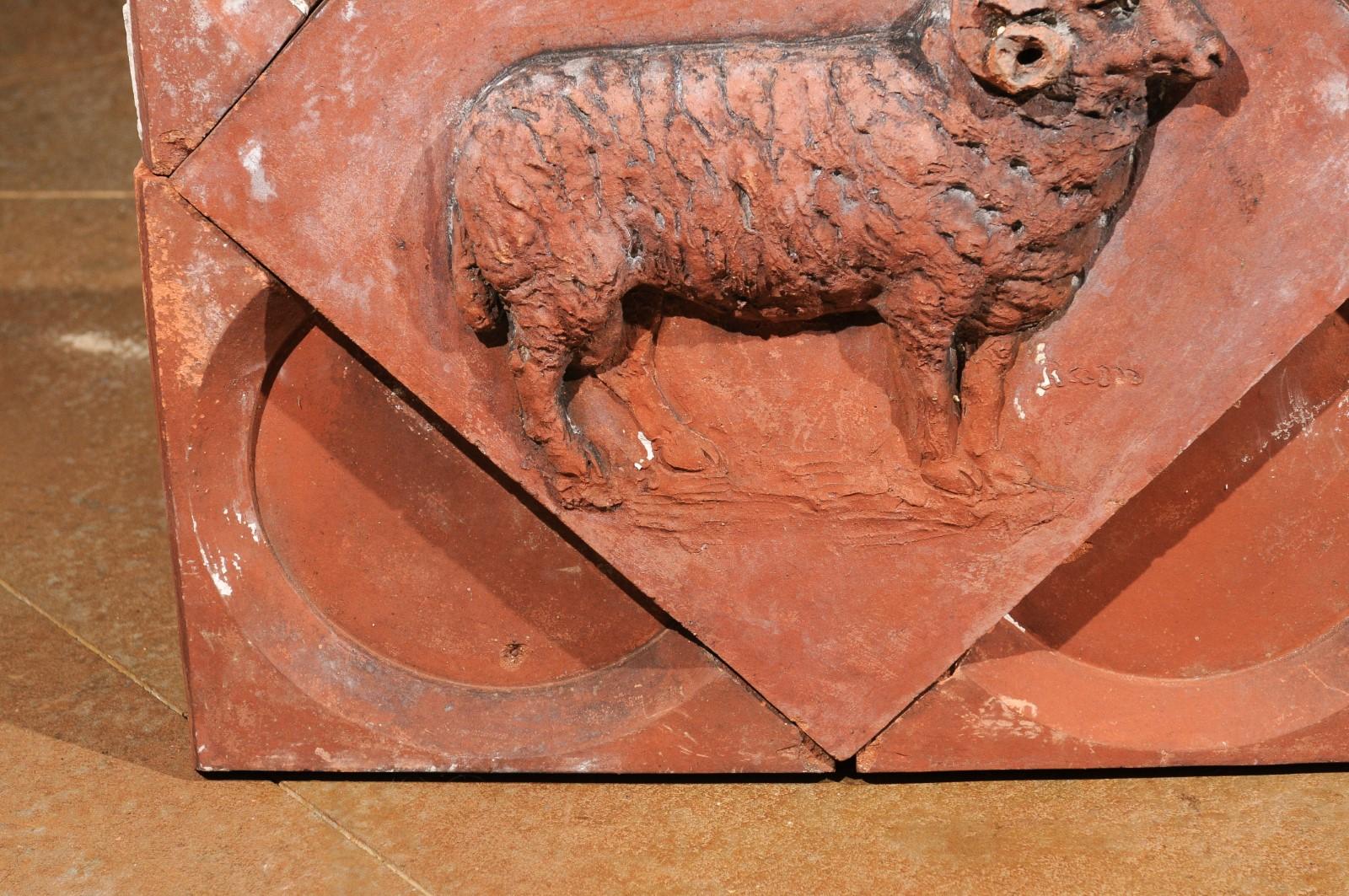 A French terracotta panel from the late 19th century, depicting a ram set in a quadrilobe. Created in France during the last quarter of the 19th century, this red terracotta panel features a ram depicted in profile, standing out beautifully on a