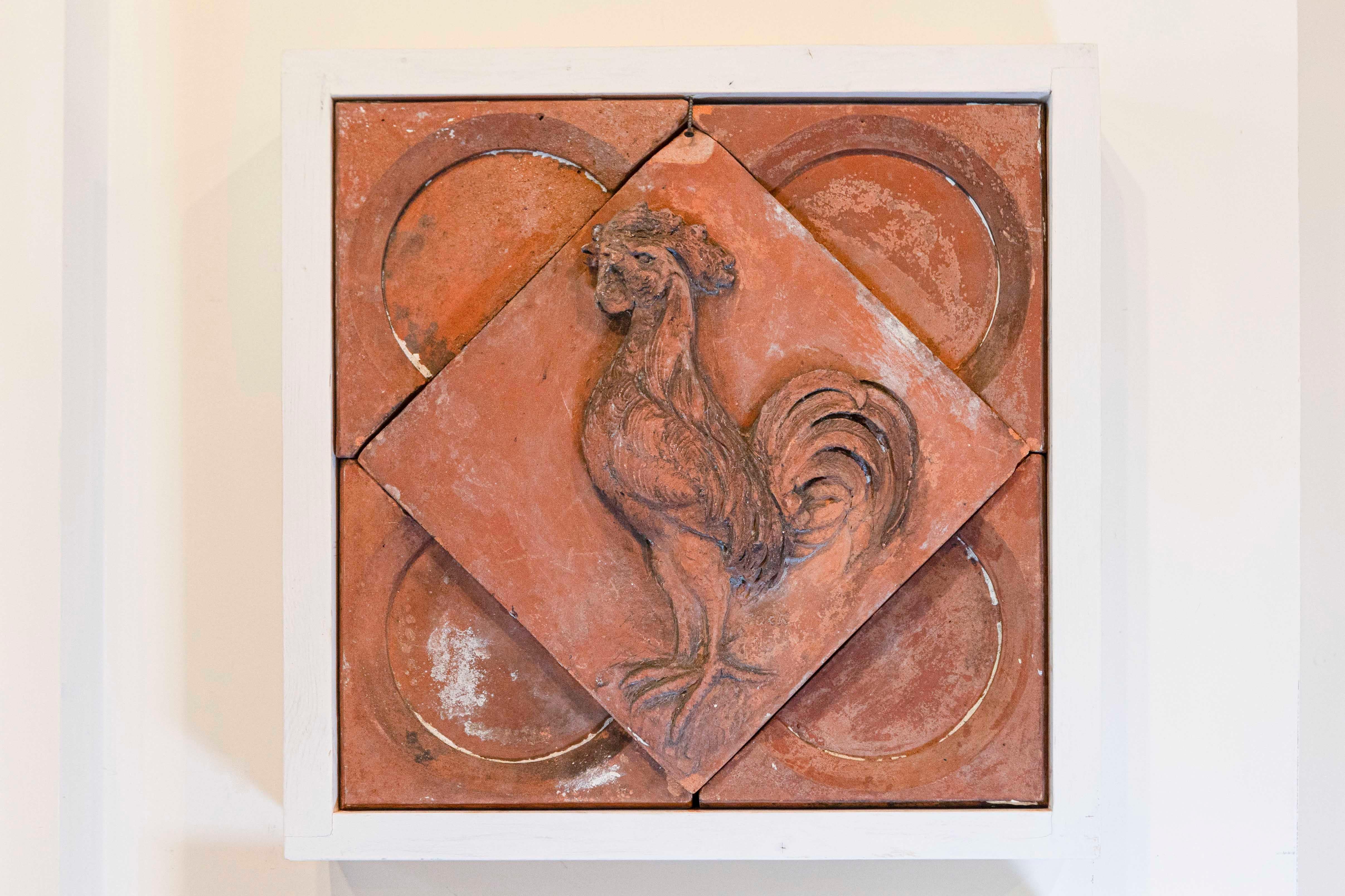 A French terracotta panel from the late 19th century, depicting a rooster set in a quadrilobe. Created during the last quarter of the 19th century, this red terracotta panel features the French national emblem the rooster, depicted in profile,
