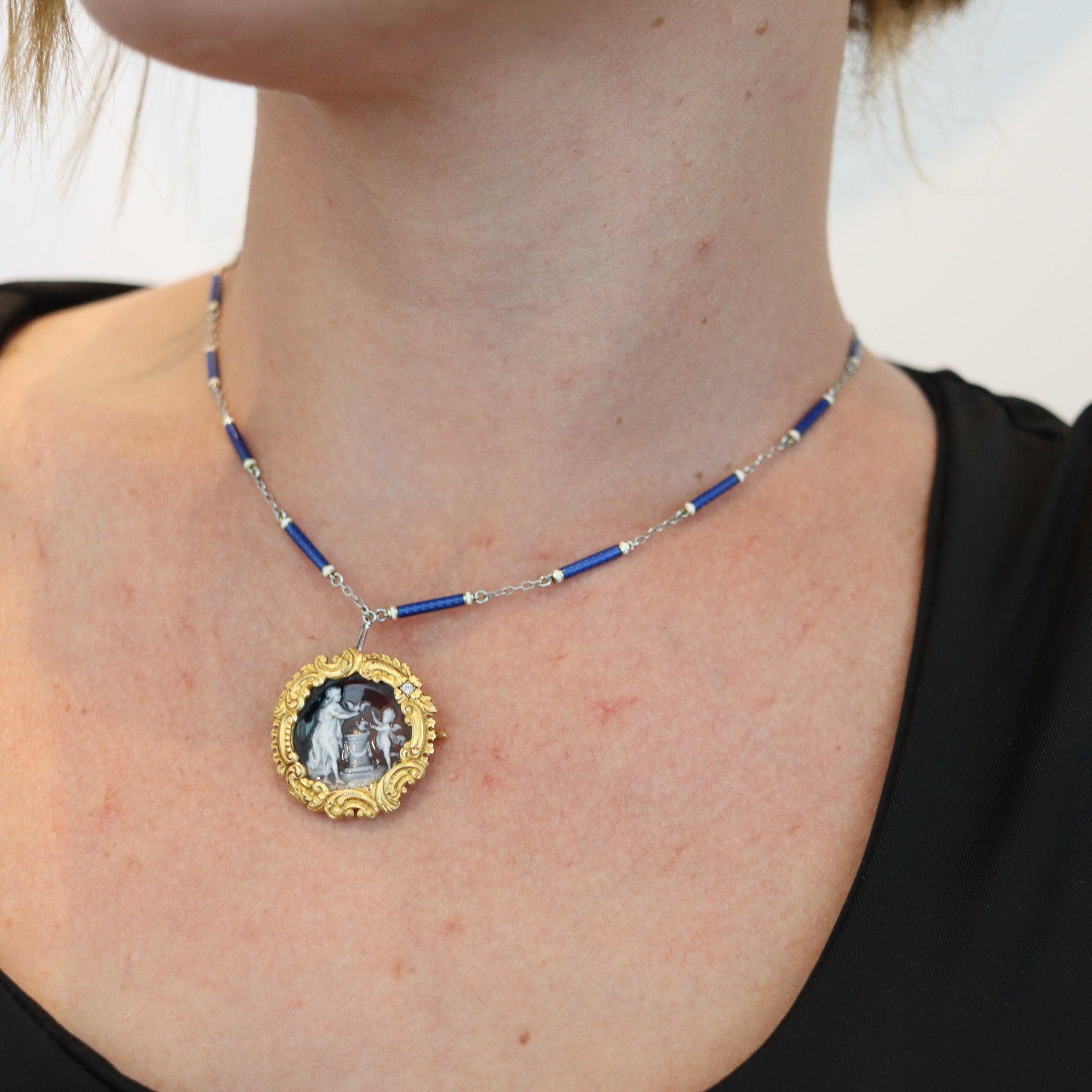 French art Nouveau enameled pendant brooch.

This is an exceptional pendant-brooch, created in Limoges France during the Art Nouveau period, back in the 1890. The rare brooch was carefully crafted with classical patterns in repousse yellow gold of