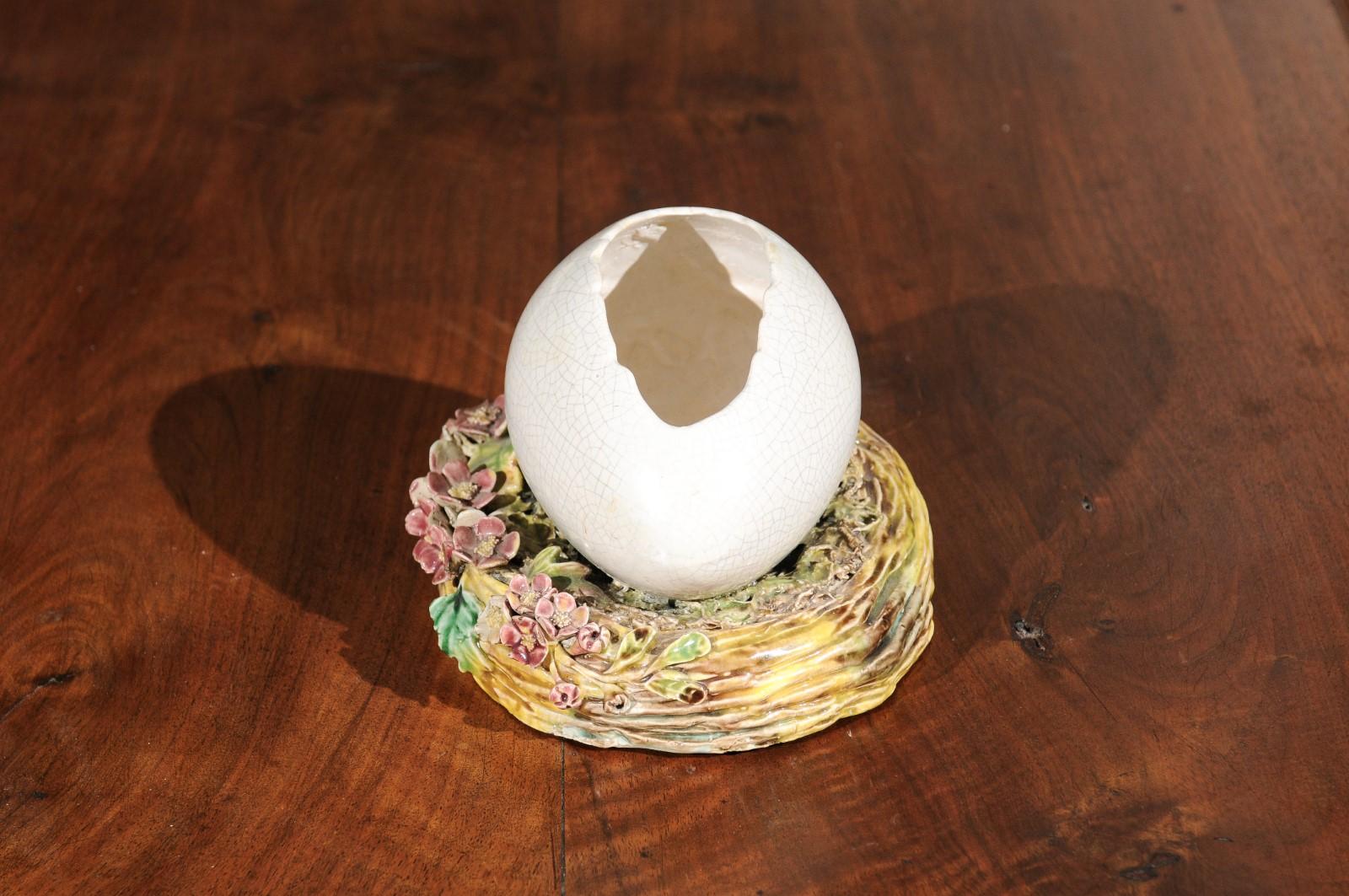 19th Century French 1890s Barbotine Majolica Egg Depicting a Cracked Shell on a Floral Nest