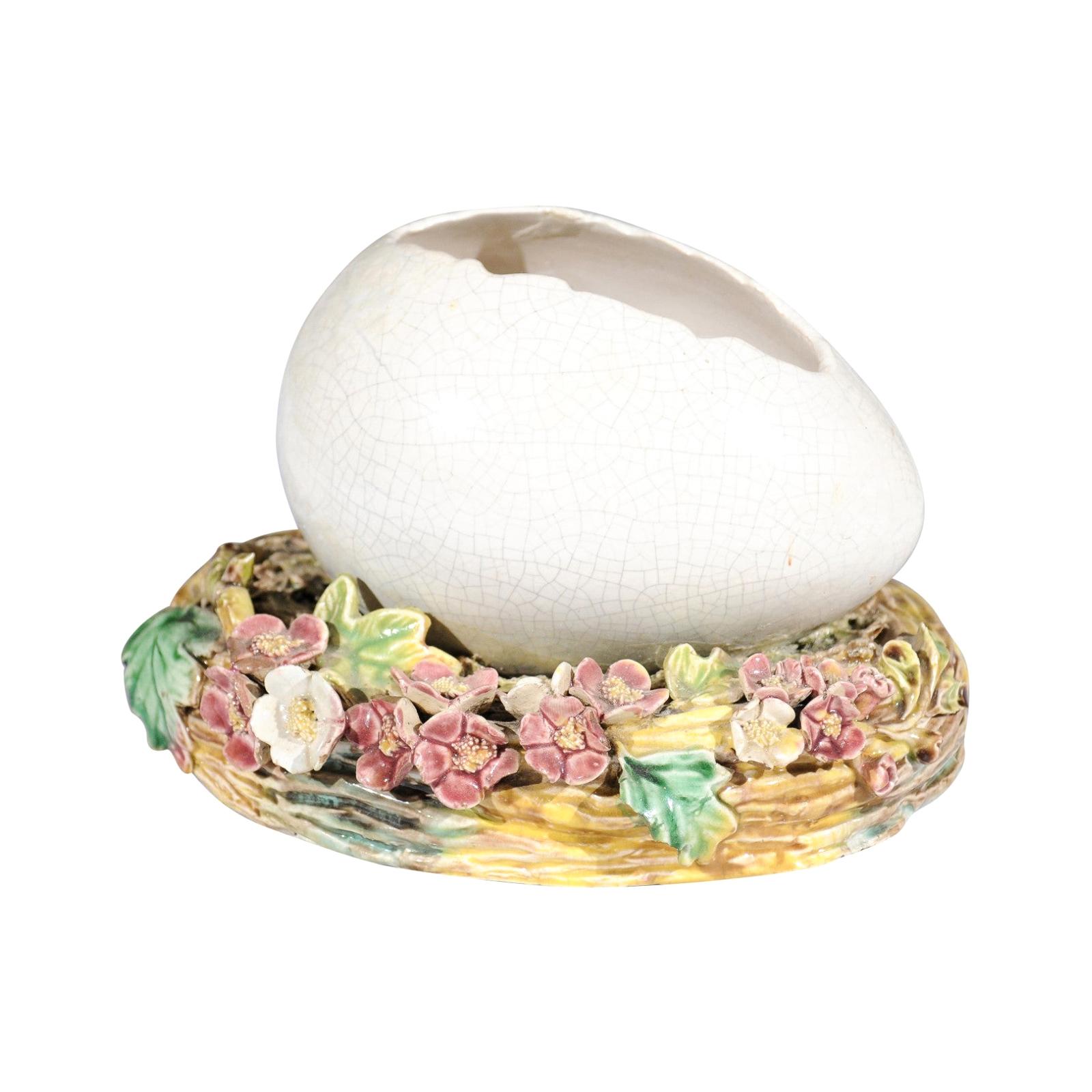 French 1890s Barbotine Majolica Egg Depicting a Cracked Shell on a Floral Nest