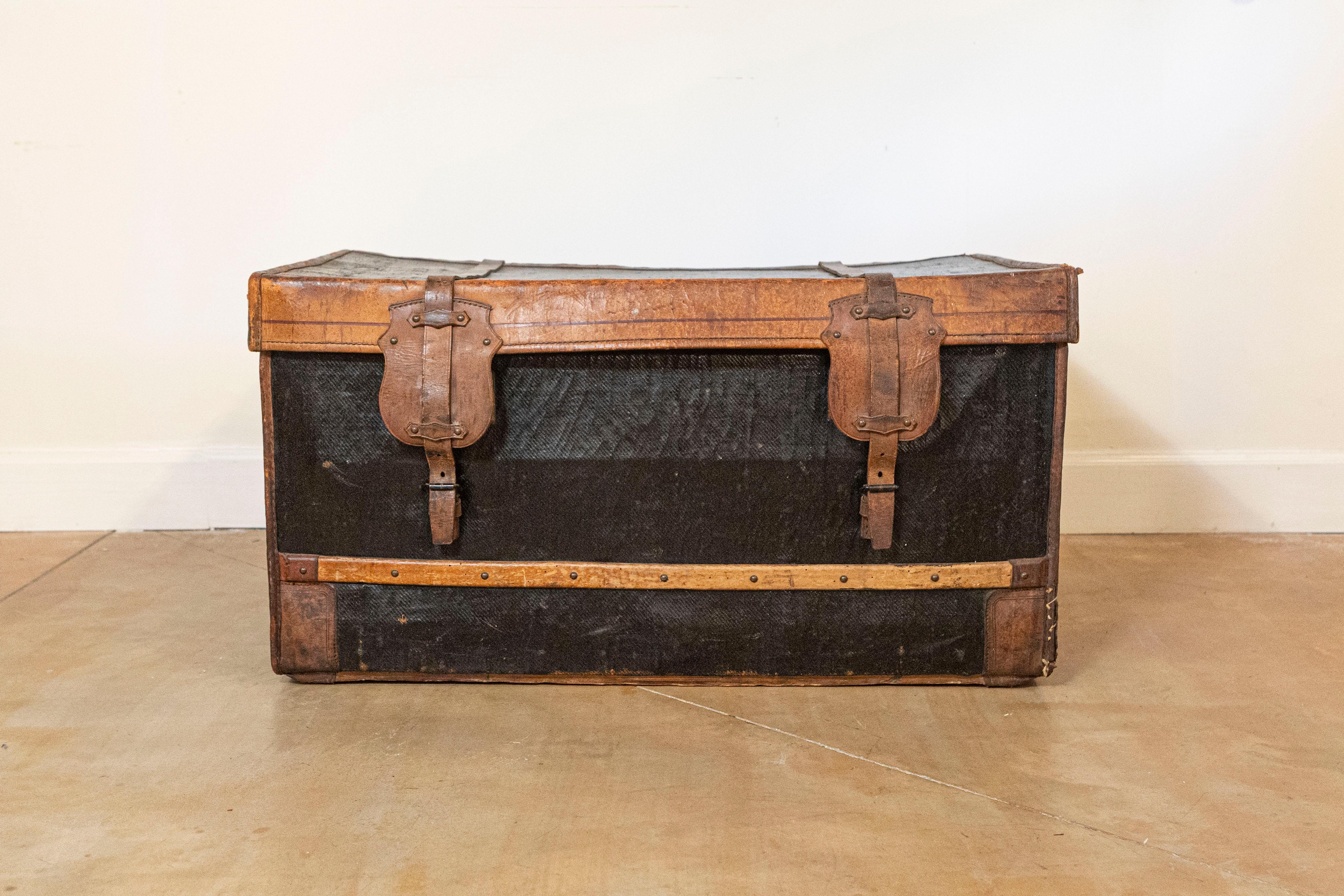 Rustic French 1890s Brown and Black Travel Trunk with Leather Straps and Aged Patina For Sale