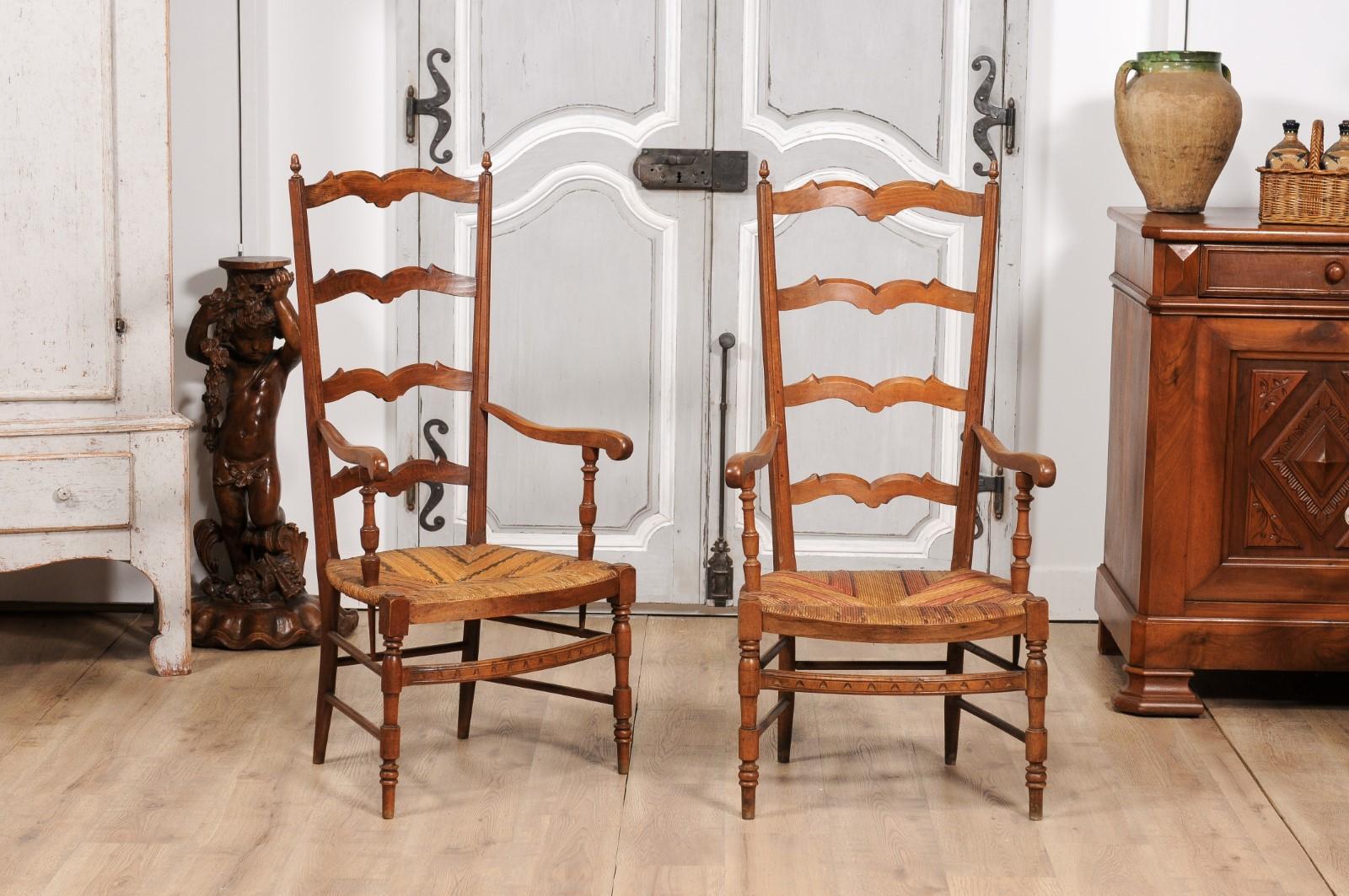 Carved French 1890s Fruitwood Ladder Back Chairs with Straw Seats and Turned Legs For Sale
