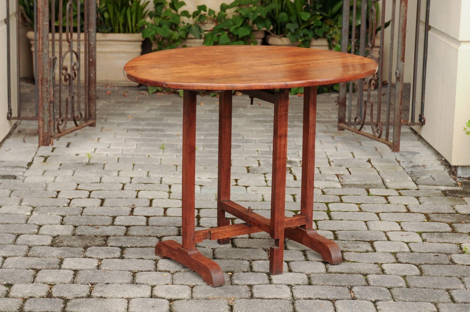 French 1890s Fruitwood Wine Tasting Table with Oval Tilt Top and Trestle Base 3