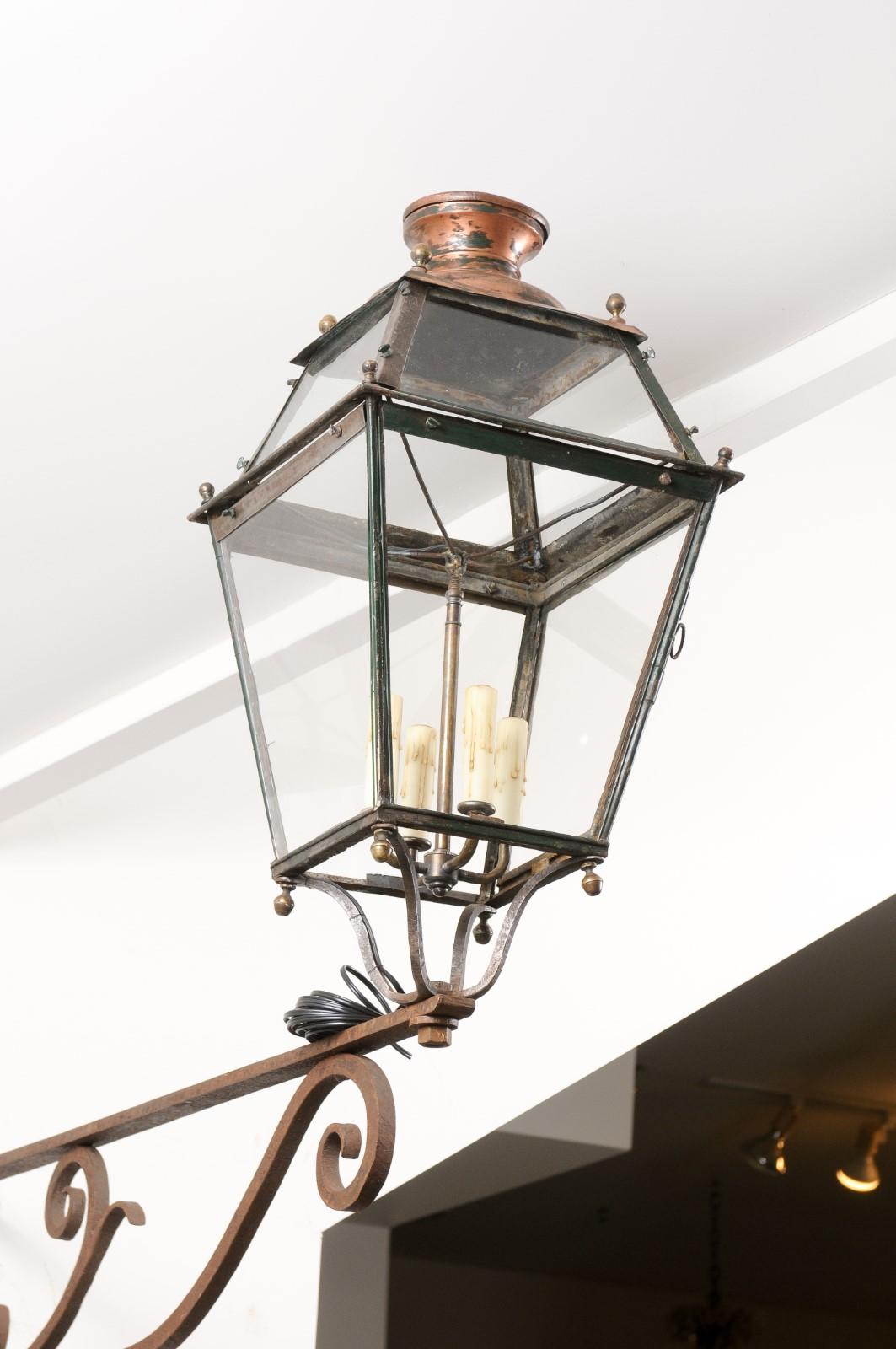 French 1890s Iron and Copper Wall Lantern with Four Lights and Scrolling Bracket In Good Condition For Sale In Atlanta, GA