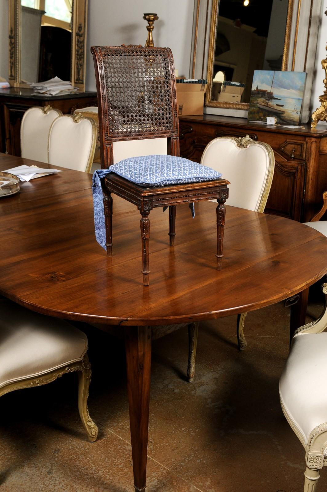 19th Century French 1890s Walnut Child's Chair with Cane Accents and Blue Upholstered Cushion