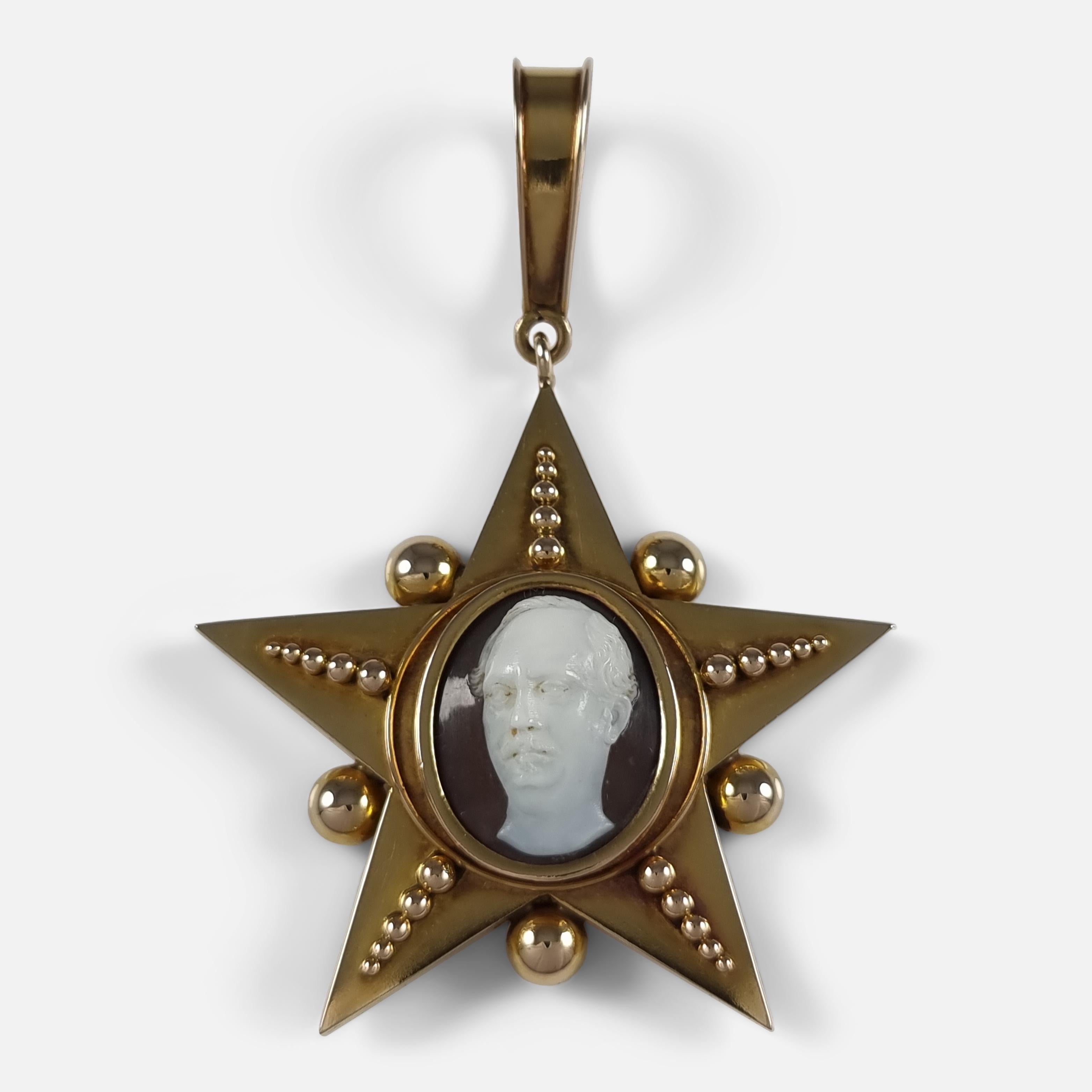 A late 19th century 18ct yellow gold and hardstone cameo pendant.

The five-ray star pendant is decorated with graduated spherical accents, featuring a centrally set oval hardstone cameo of a gentleman, and to the reverse is a removable panel