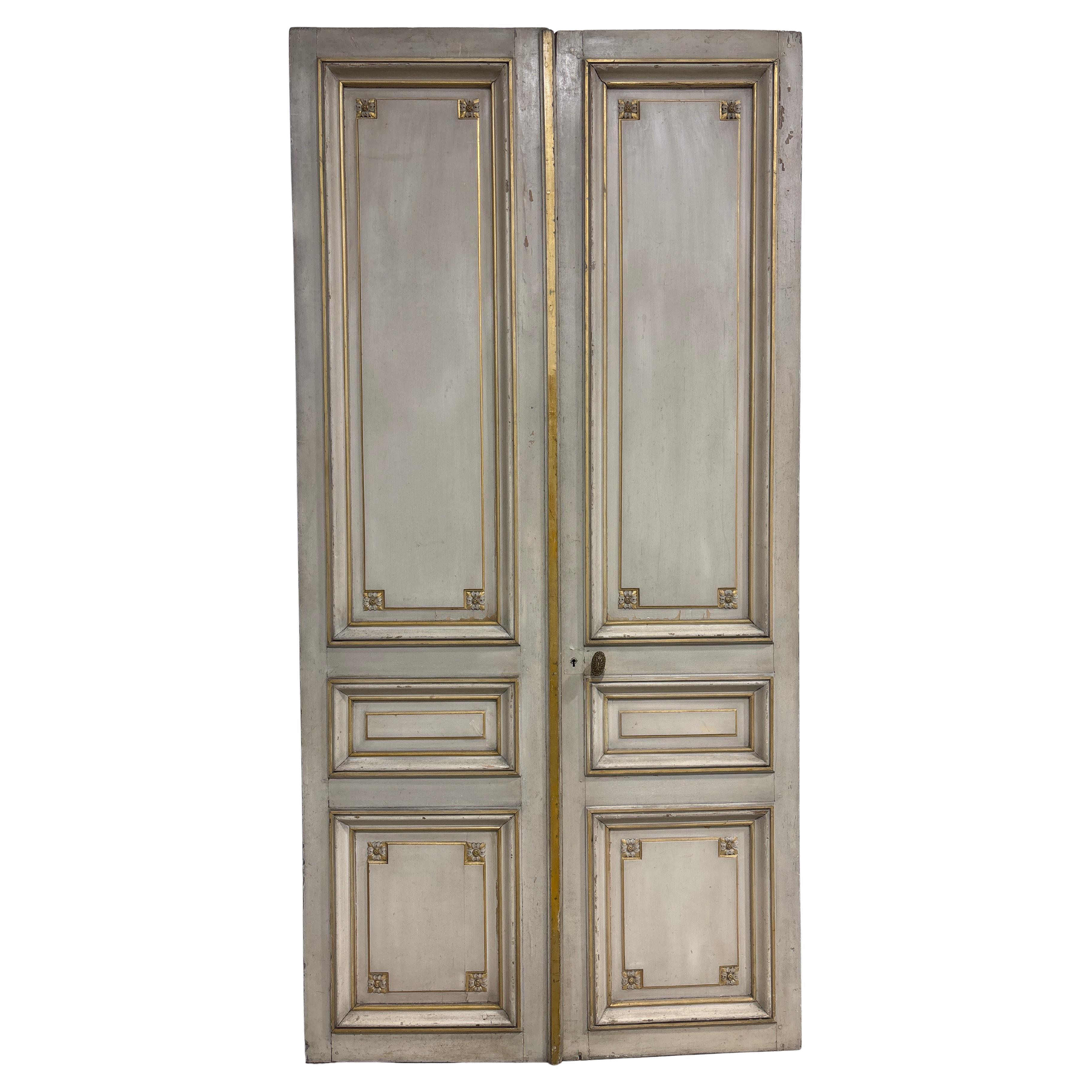 Those magnificent pair of French Doors are painted with some gilt. This is an original work of the 18th century. It comes from a French Parisian Home.