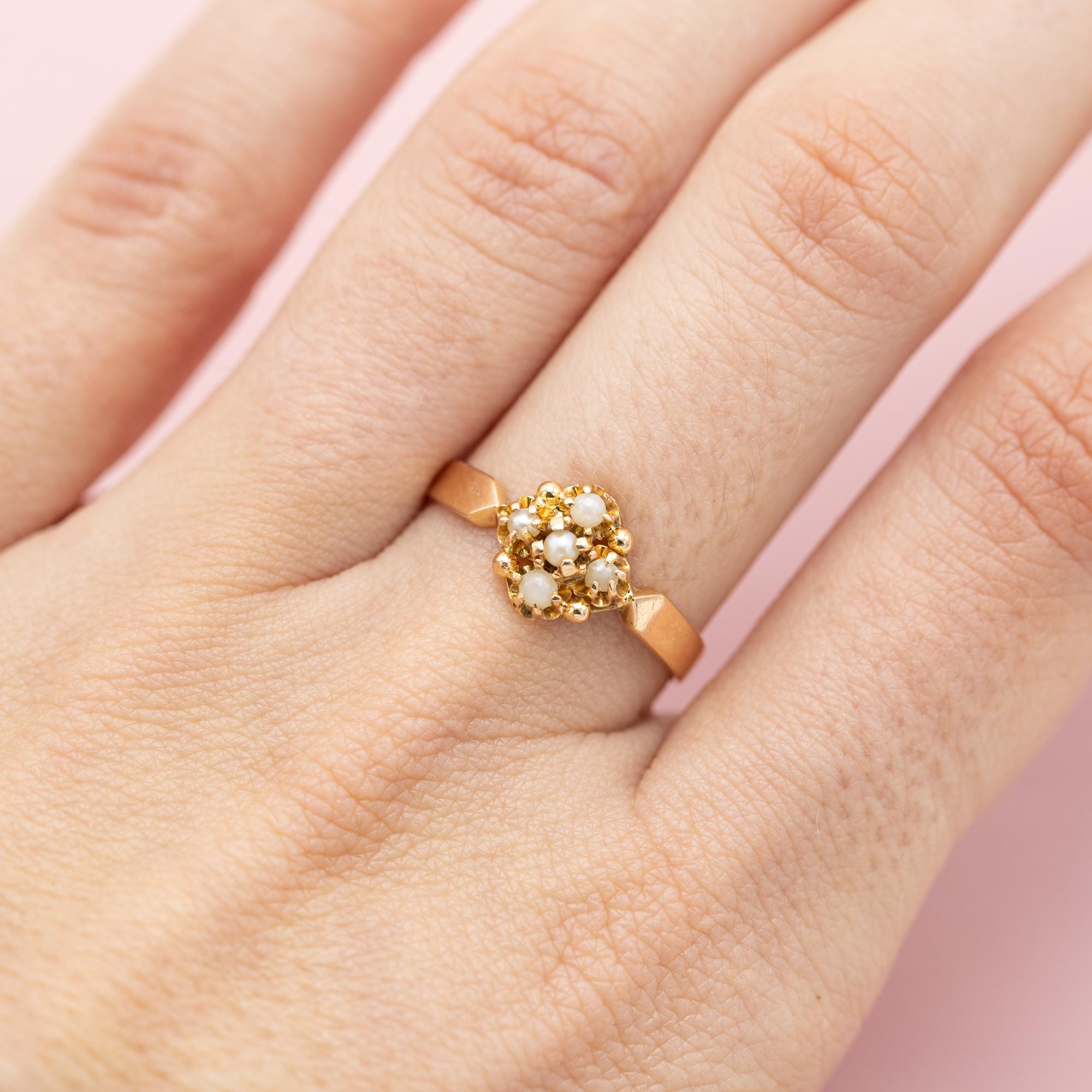 For sale is antique patina gold ring which stole our hearts the minute we laid eyes on her. This marvellous floral ring is made in 18K pinkish yellow gold and set with five white pearls. These where set in the shape of a flower. Two of these pearls