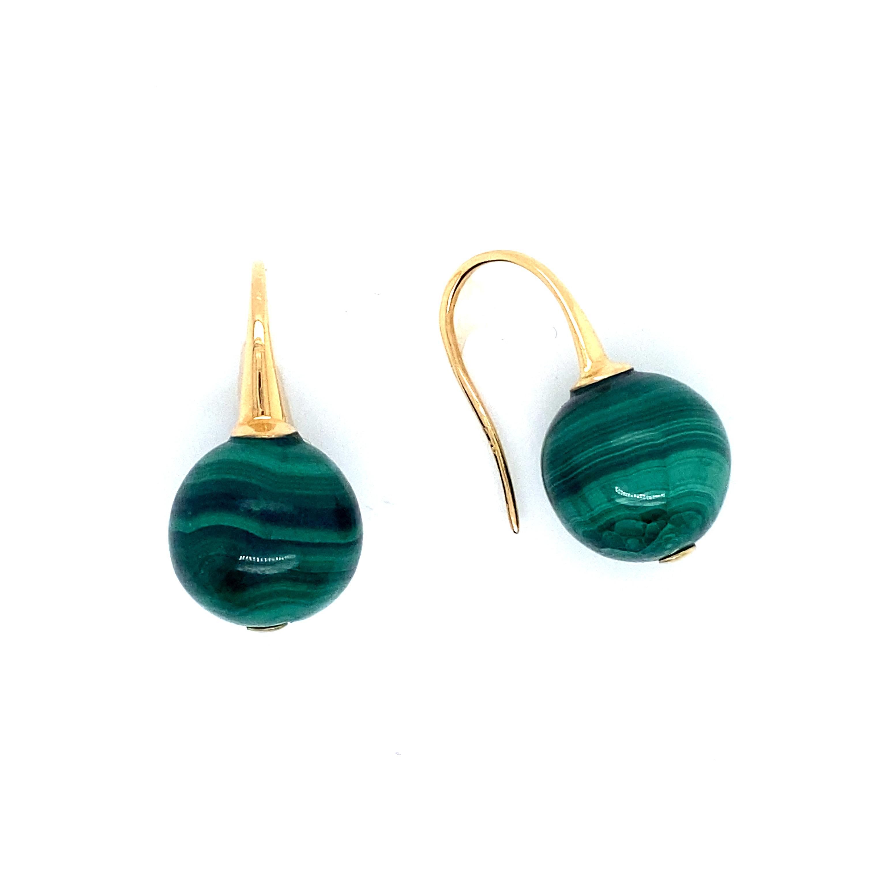 18K Gold Malachite Pendants Earrings
Lovely pair of gold pendants earrings with a ball of malachite on each earrings. The Malakite beads are crossed by a gold rod.

Details of product:

Carats: 18 carats
Lenght: 2.7 cm/ 1.8 inch
Width: 1.4 cm/ 0.5