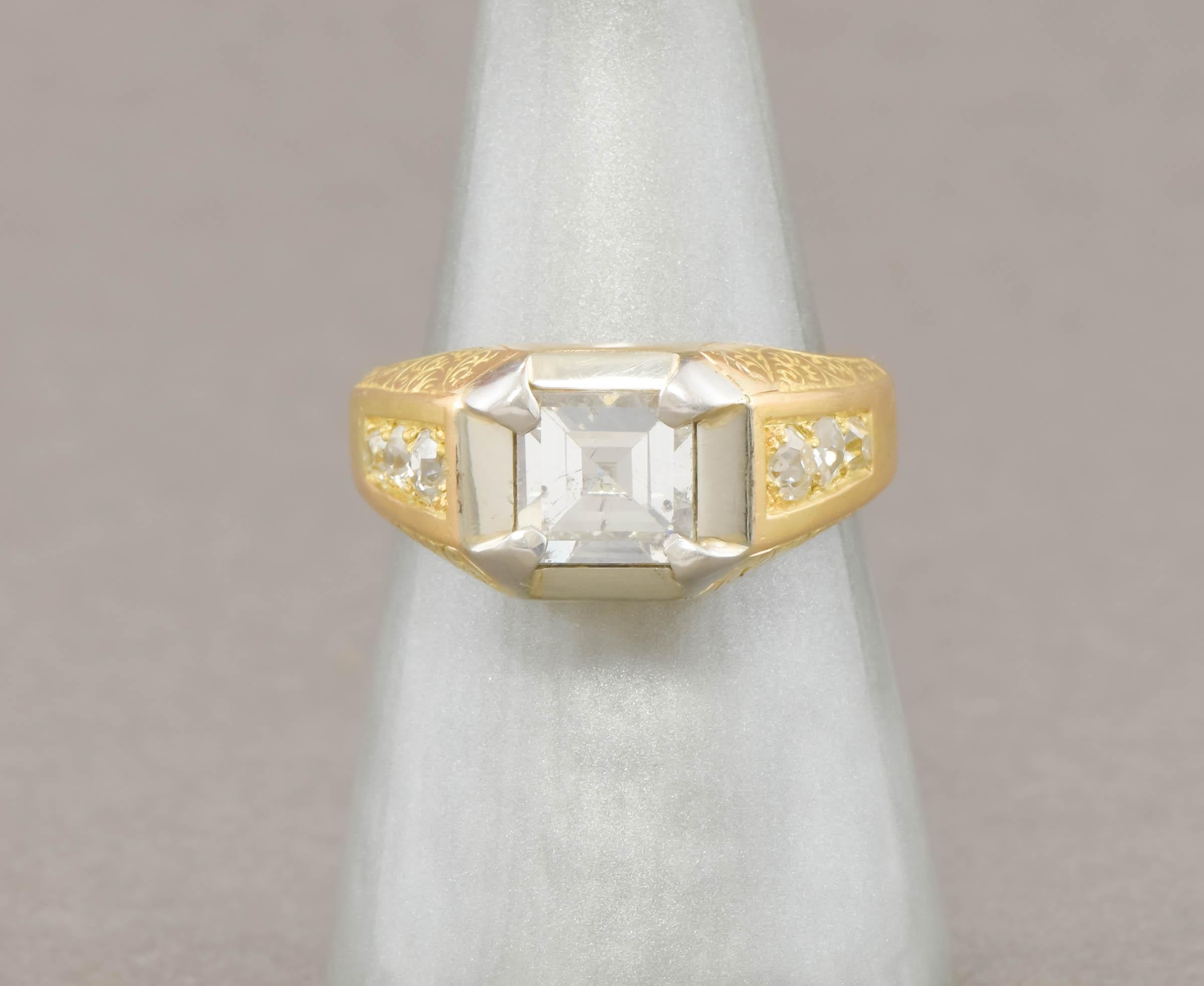 Offered is a vintage, heavy 18K gold French ring with a large, sparkly square step cut diamond center, and old European cut diamond shoulders.  Elegant hand engraving adorns each side of the ring, with the center stone set off by platinum.  The