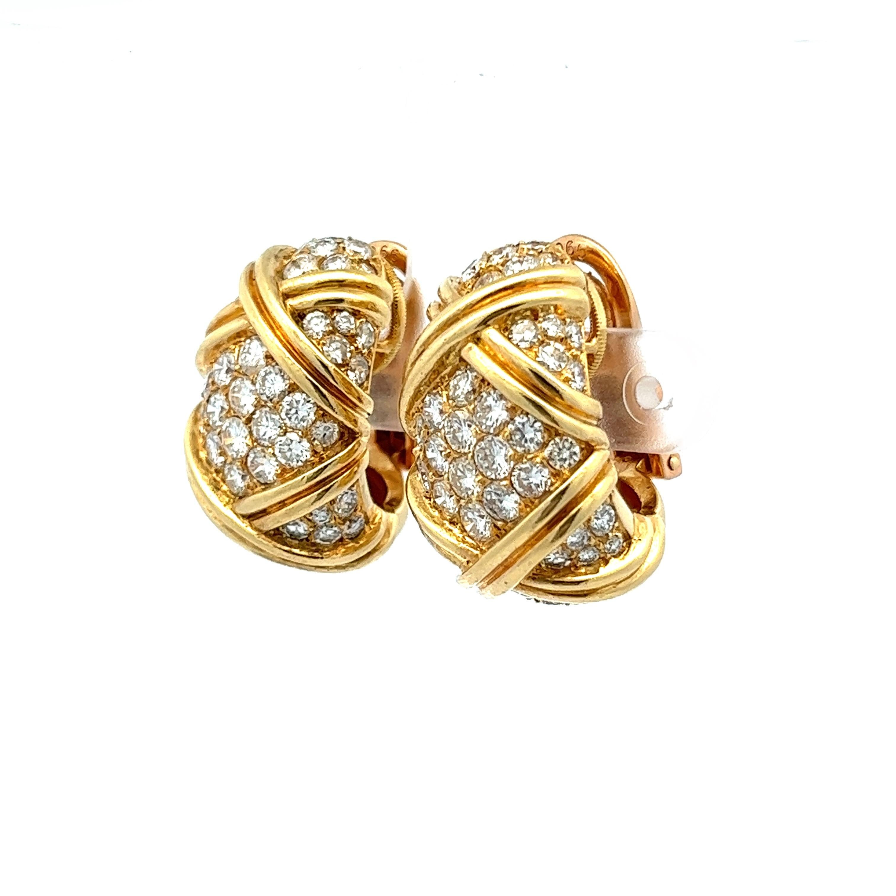 Exhibiting a blend of luxury and craftsmanship, these French-made 18 karat yellow gold clip-on earrings are sure to make statement. 

The half-hoop huggies house an impressive assembly of 106 VS F-G diamonds, with a collective weight of 6.18 carats.