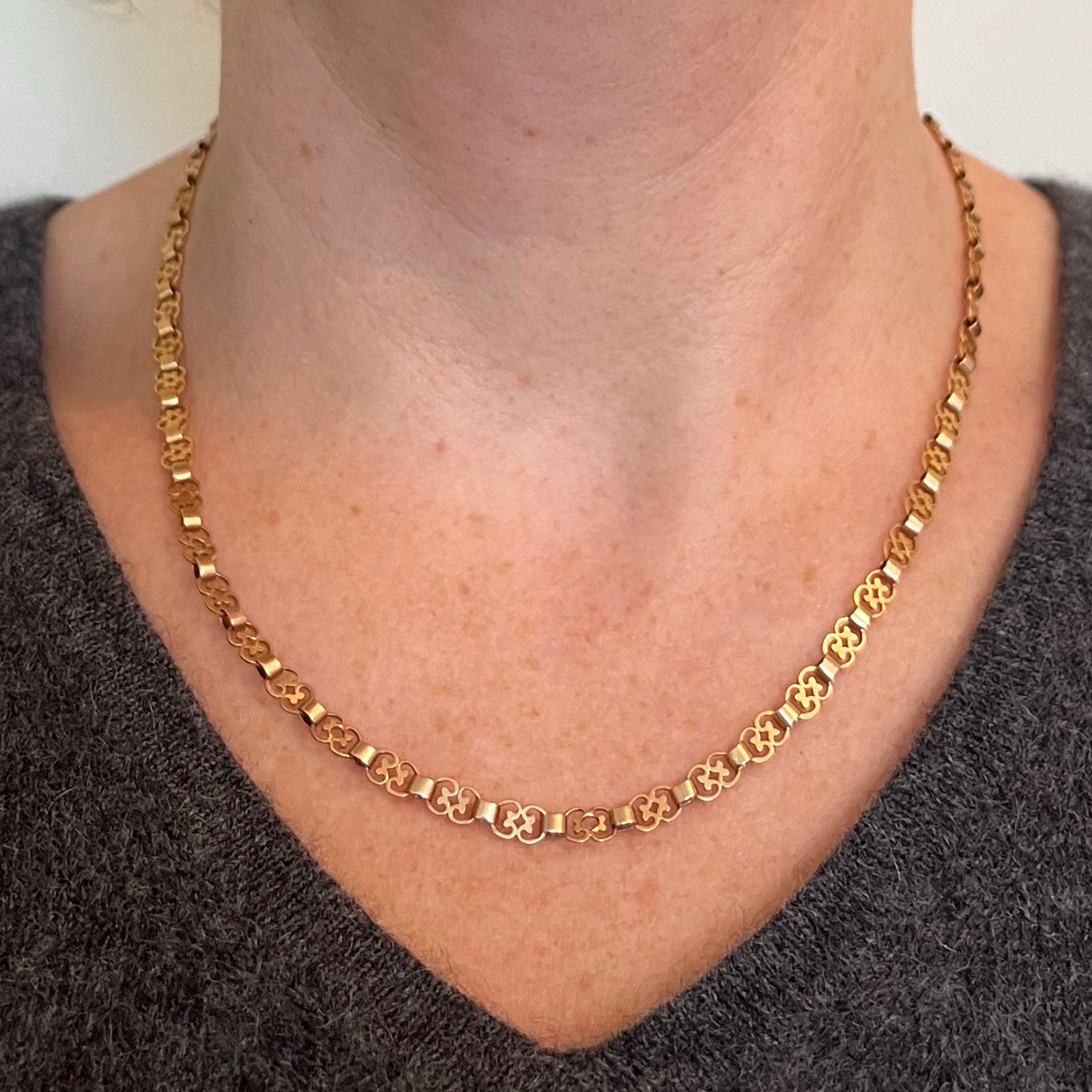 A French 18 karat (18K) rose gold chain necklace featuring fancy-shaped links connected by oval-shaped links to a box clasp. Stamped with a partial French eagle’s head for 18 karat gold and a partial unknown maker’s mark. 18” long.

Dimensions: 45 x