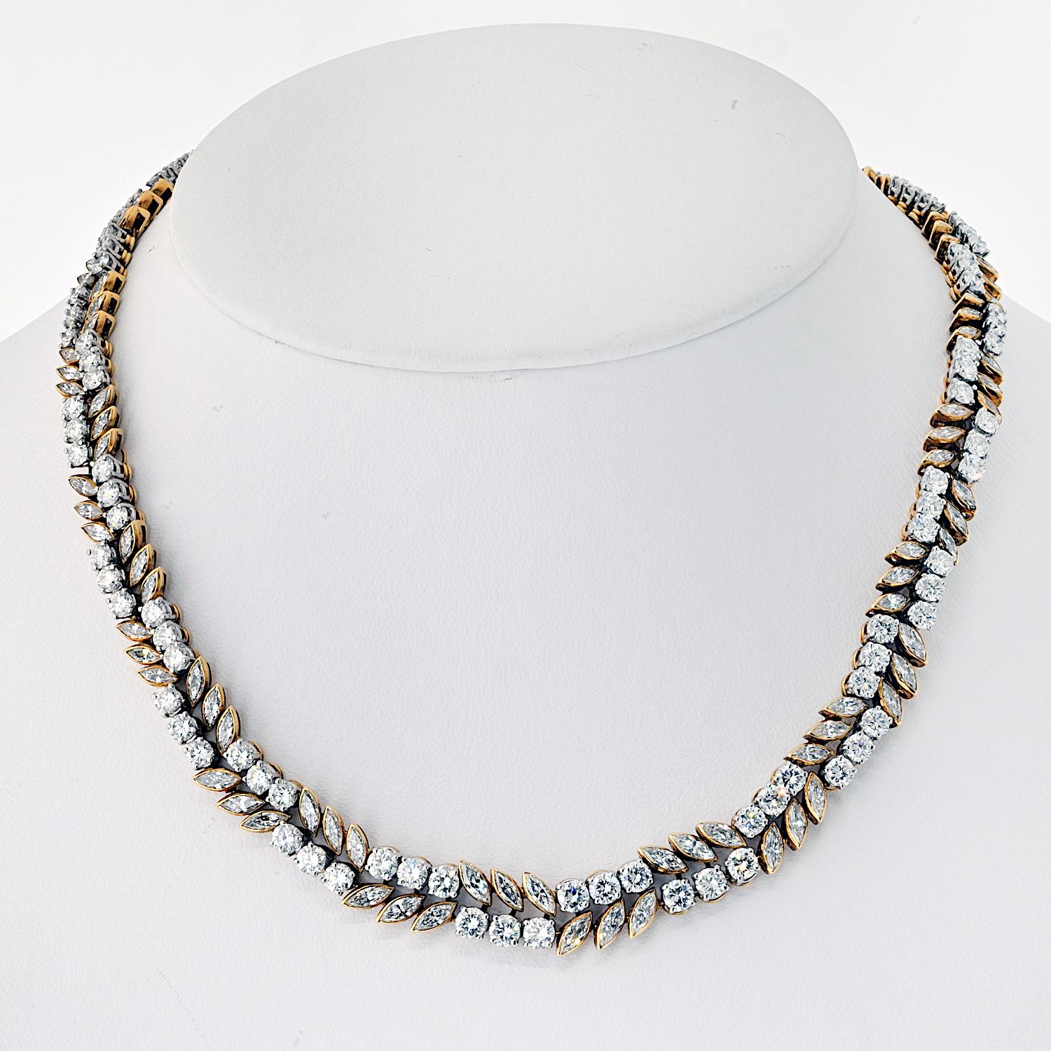 French 18K Yellow And White Gold 32.00 Carat Diamond Necklace.

This French-made diamond necklace is a true masterpiece, featuring a stunning combination of round and marquise cut diamonds. Set with approximately 228 diamonds totaling 32.00 carats,