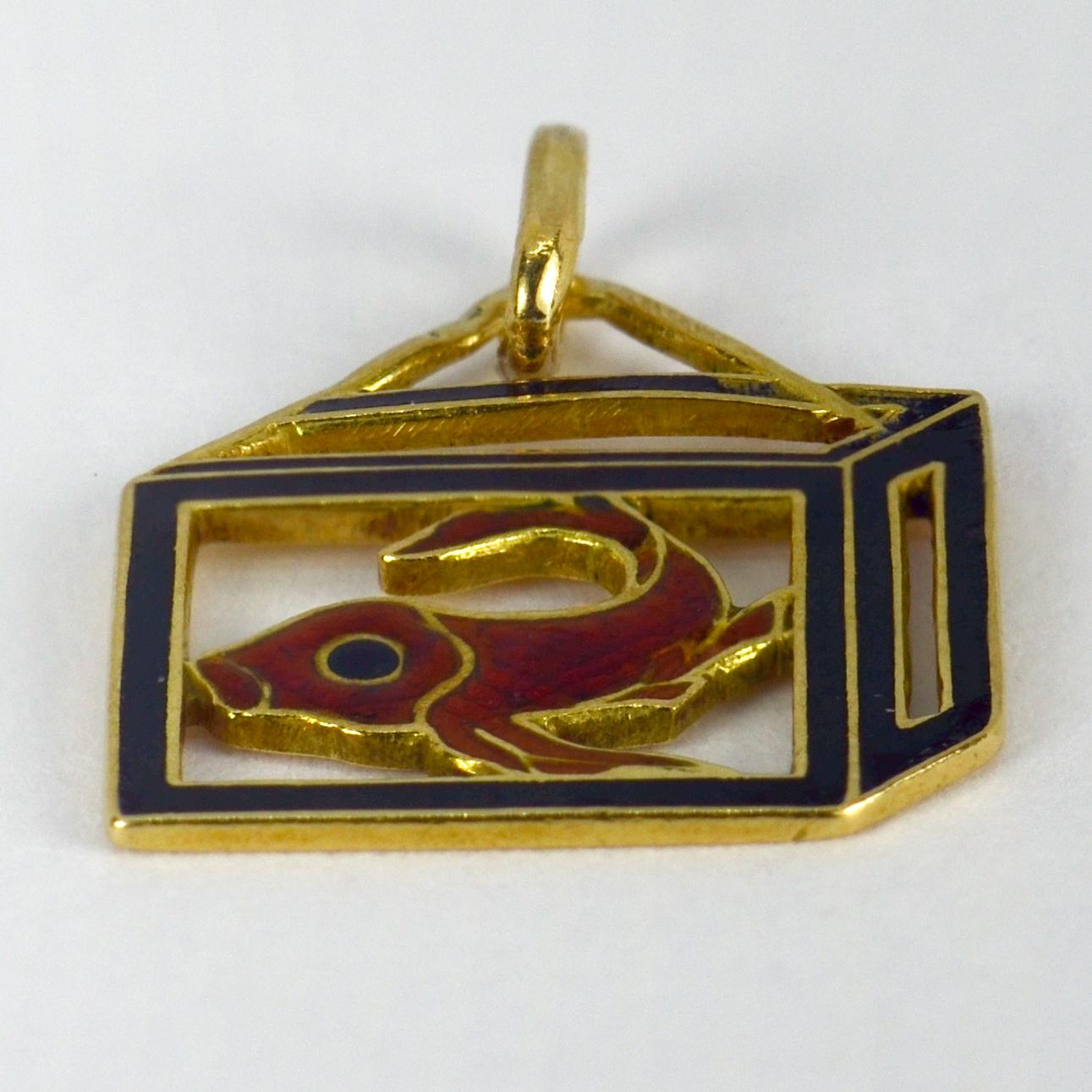 A French 18 karat (18K) yellow gold and enamel charm pendant designed as a Koi carp in a black box. Stamped with the eagle’s head for 18 karat gold and French manufacture.
 
Dimensions: 1.6 x 1.4 x 0.1 cm (not including jump ring)
Weight: 1.08 grams
