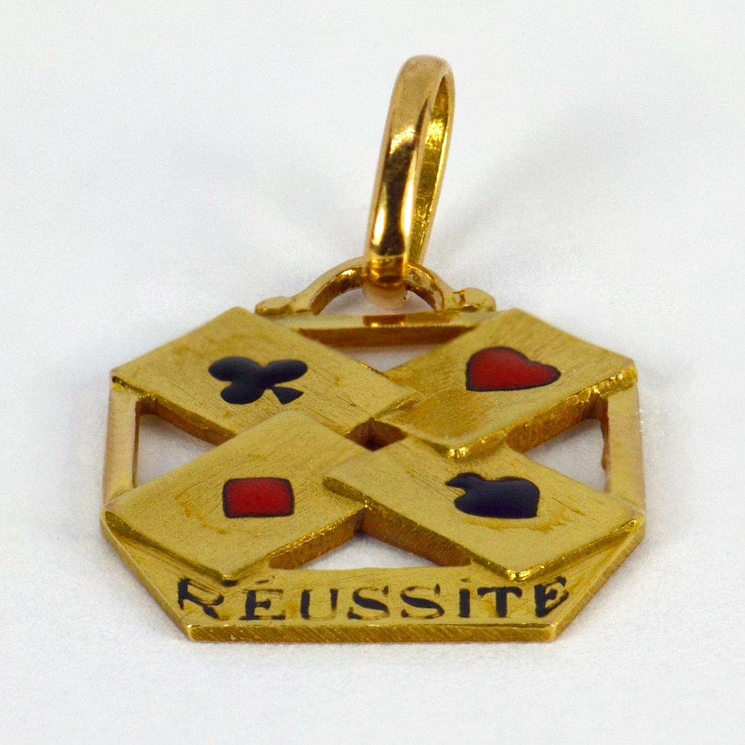 A French 18 karat (18K) yellow gold gambling cards charm pendant designed as a set of four aces, with the word ‘Reussite’ (Success) on a banner below. Stamped with the eagle’s head for 18 karat gold and French manufacture.

Dimensions: 1.8 x 1.4 x