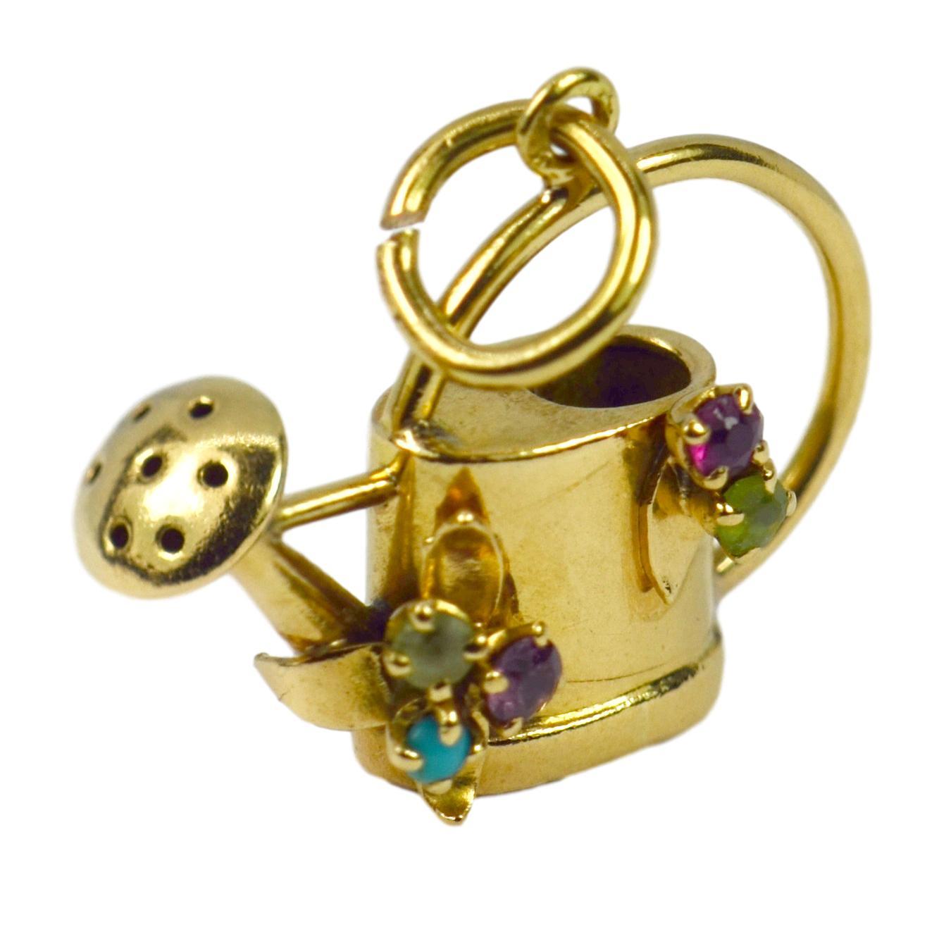 A French 18 karat (18K) yellow gold charm pendant designed as a watering can with paste gems. Stamped with the eagle’s head punch mark for 18 karat gold and French manufacture.

Dimensions: 2.2 x 2.4 x 0.5 cm
Weight: 3.34 grams

