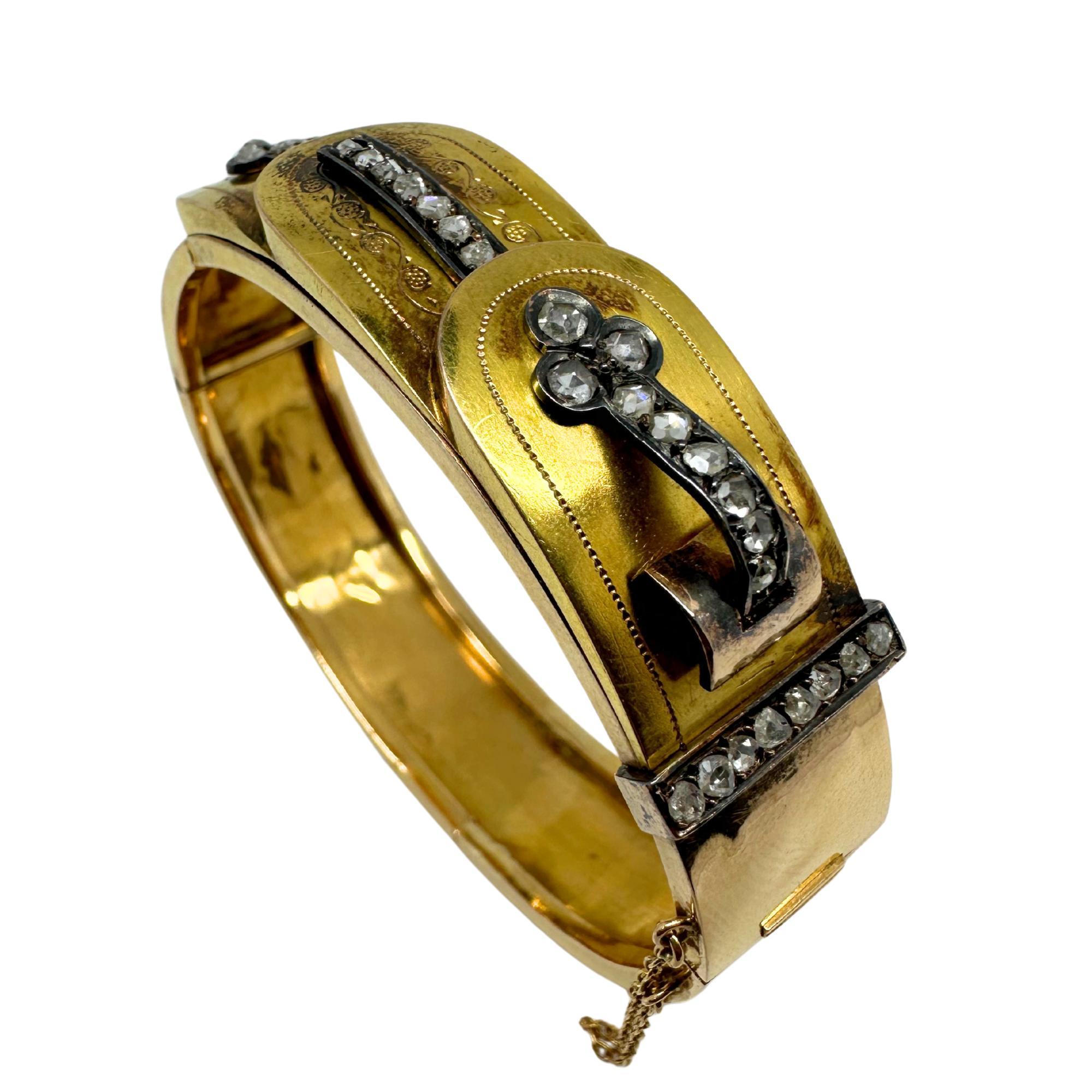 This 18K yellow gold bangle features rose-cut diamonds in a bold belt and buckle motif — a popular symbol of loyalty and strength during the era. Set with approximately 0.75 carats of rose-cut diamonds, the design showcases intricate detailing and