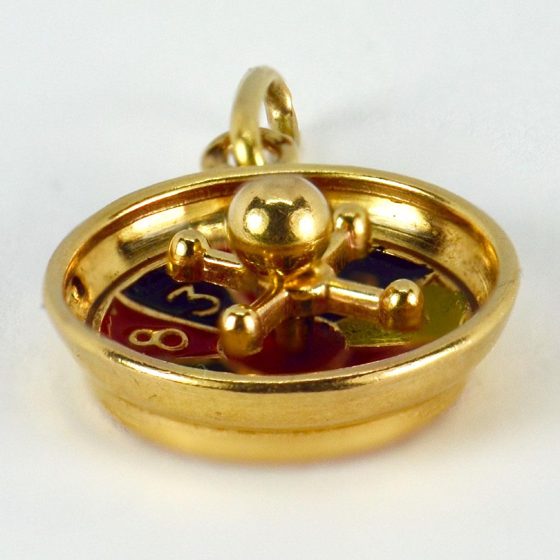 A French 18 karat (18K) yellow gold charm pendant designed as a roulette wheel. Stamped with the eagles head for French manufacture and 18 karat gold with an unknown maker’s mark.

Dimensions: 1.7 x 1.4 x 0.65 cm (not including jump ring)
Weight: