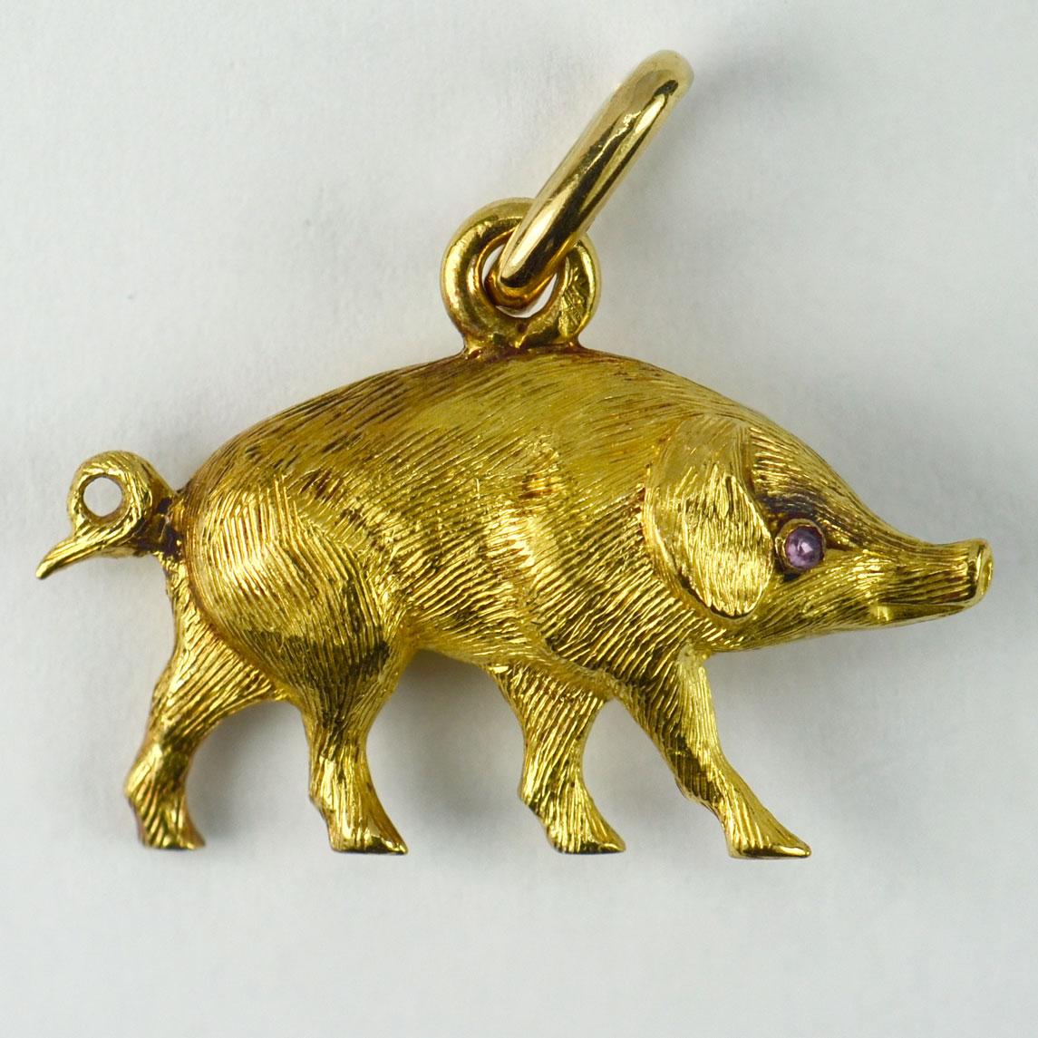 A French 18 karat (18K) yellow gold charm pendant realistically designed as 3-dimensional pig with rose-cut ruby eyes. Stamped with the eagle’s head for French manufacture and 18 karat gold.

Dimensions: 1.7 x 2.5 x 0.7 cm (not including jump
