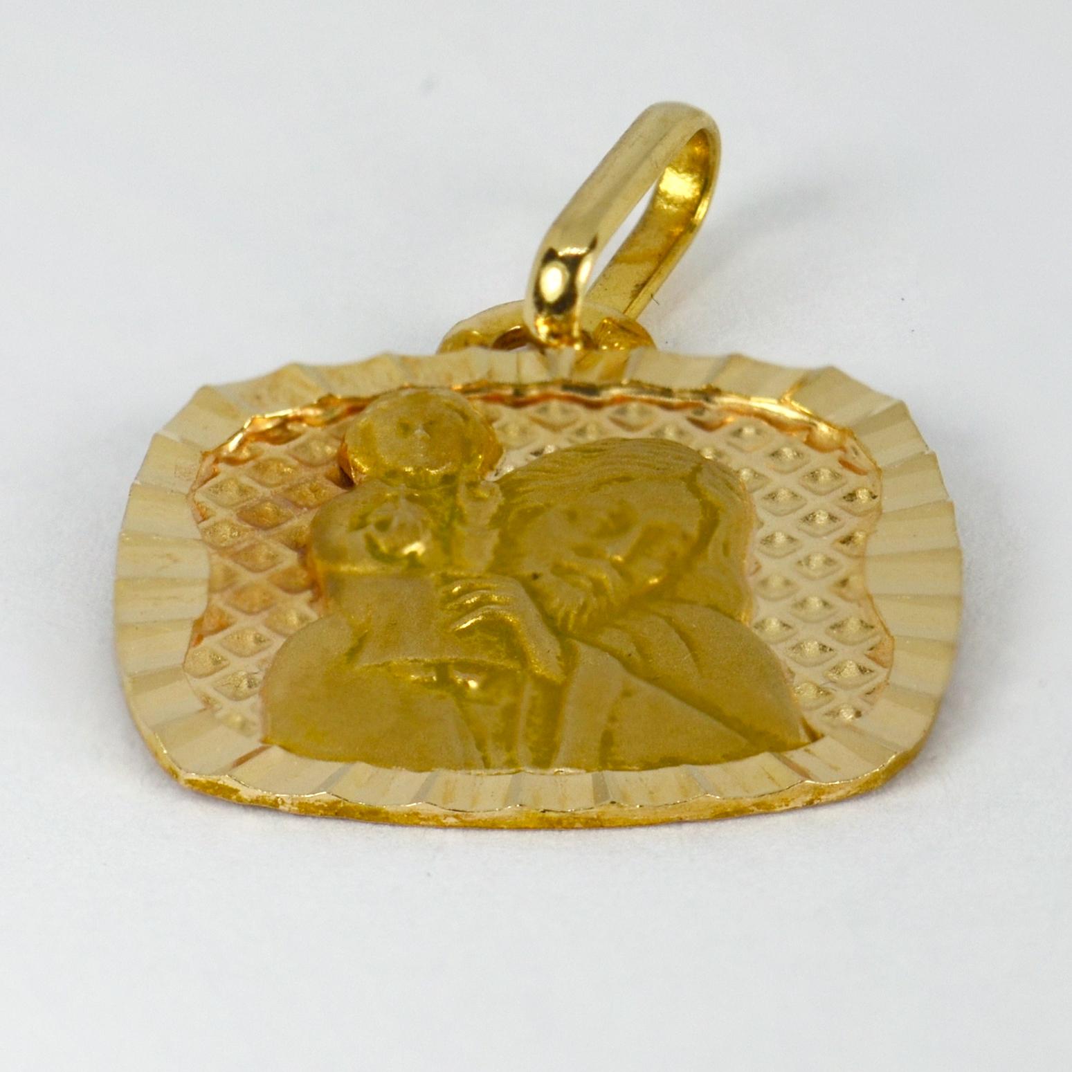 A French 18 karat (18K) yellow gold charm pendant designed as a medal depicting Saint Christopher carrying the infant Christ. Stamped with the eagles head for 18 karat gold and French manufacture and an unknown makers mark.

Dimensions: 1.8 x 1.6 x