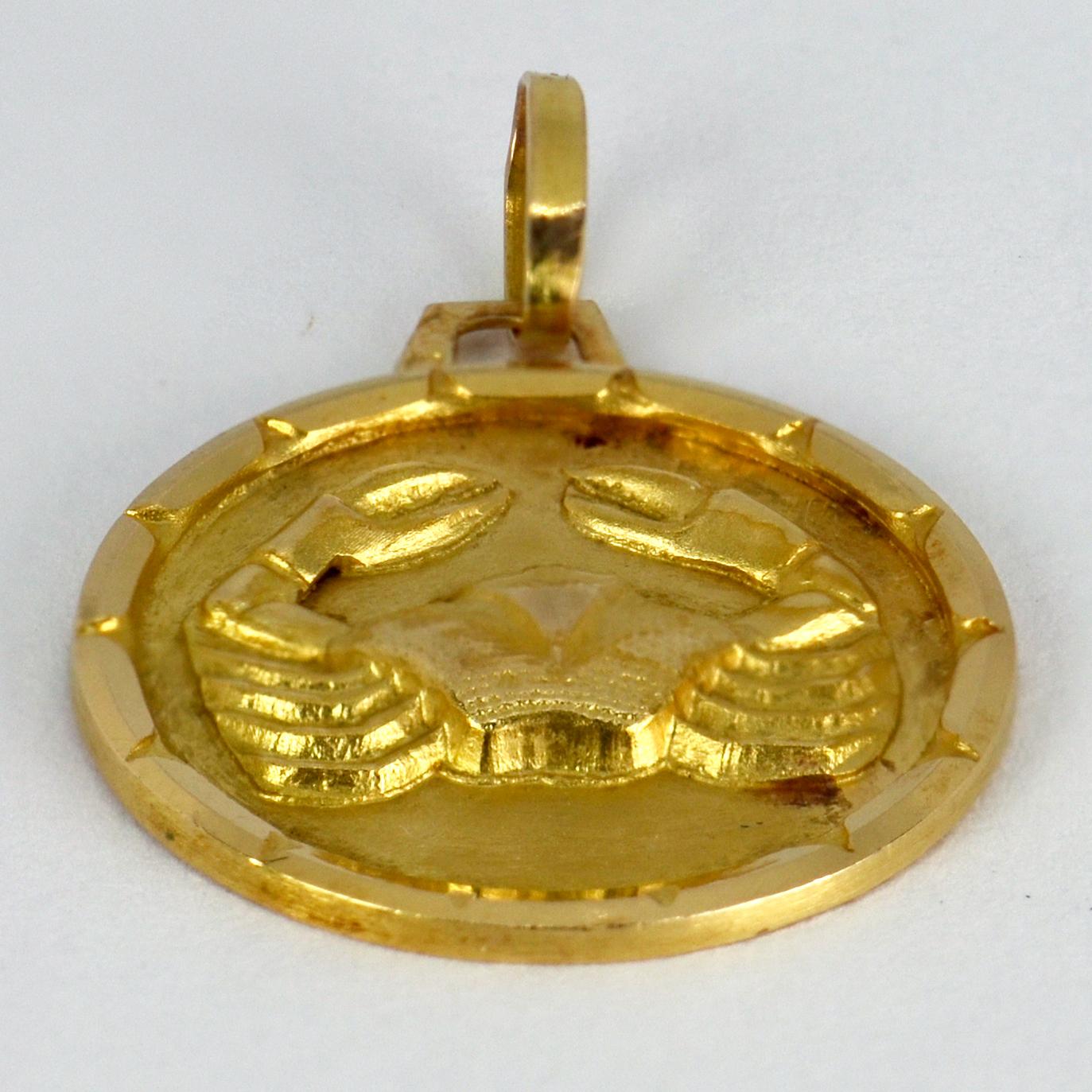 A French 18 karat (18K) yellow gold charm pendant designed as the zodiac star sign of Cancer, depicting a crab. Stamped with the French eagle’s head for 18 karat gold.

Dimensions: 2.2 x 1.9 x 0.2 cm (not including jump ring)
Weight: 2.20 grams
