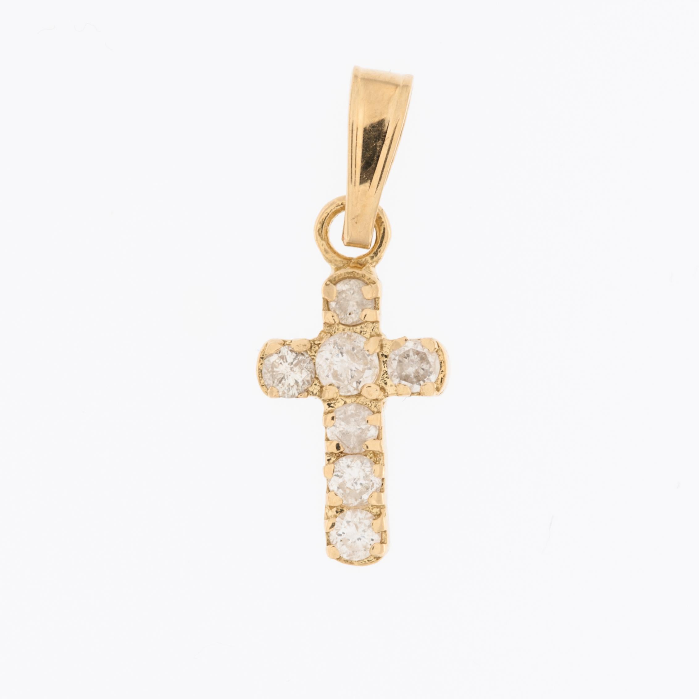 The French 18kt Yellow Gold Cross with Diamonds is an elegant piece of jewelry. 

This cross pendant is crafted from 18-karat yellow gold, which is known for its rich and warm color. 
The design of this cross pendant is classic one, combining the