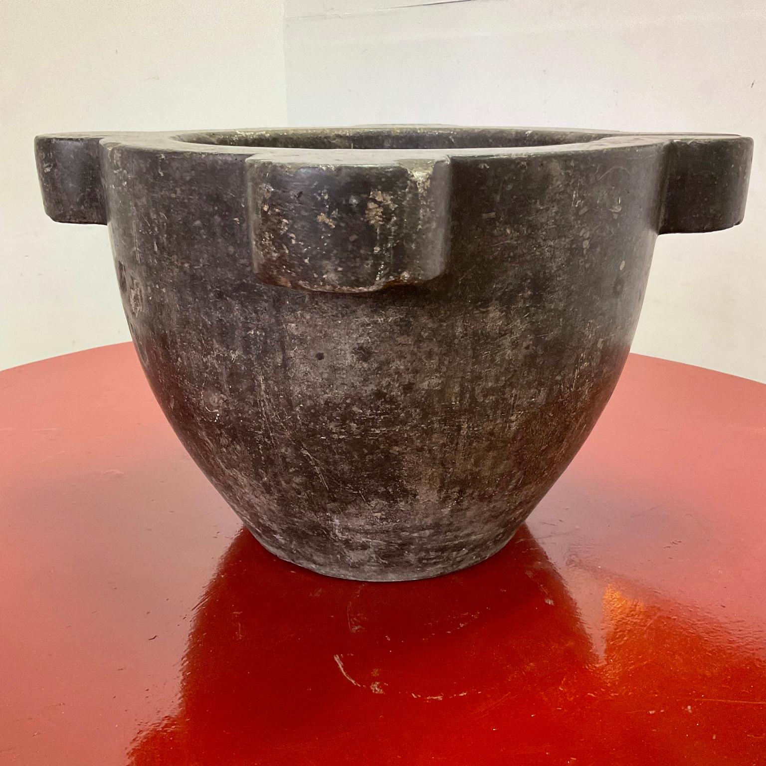 Exceptional and rare, early 19th-century large black marble apothecary mortar with ears and spout.
Outside dimensions :
51cm diameter and 30.5cm height
Inside dimensions :
31cm diameter and 20cm depth.