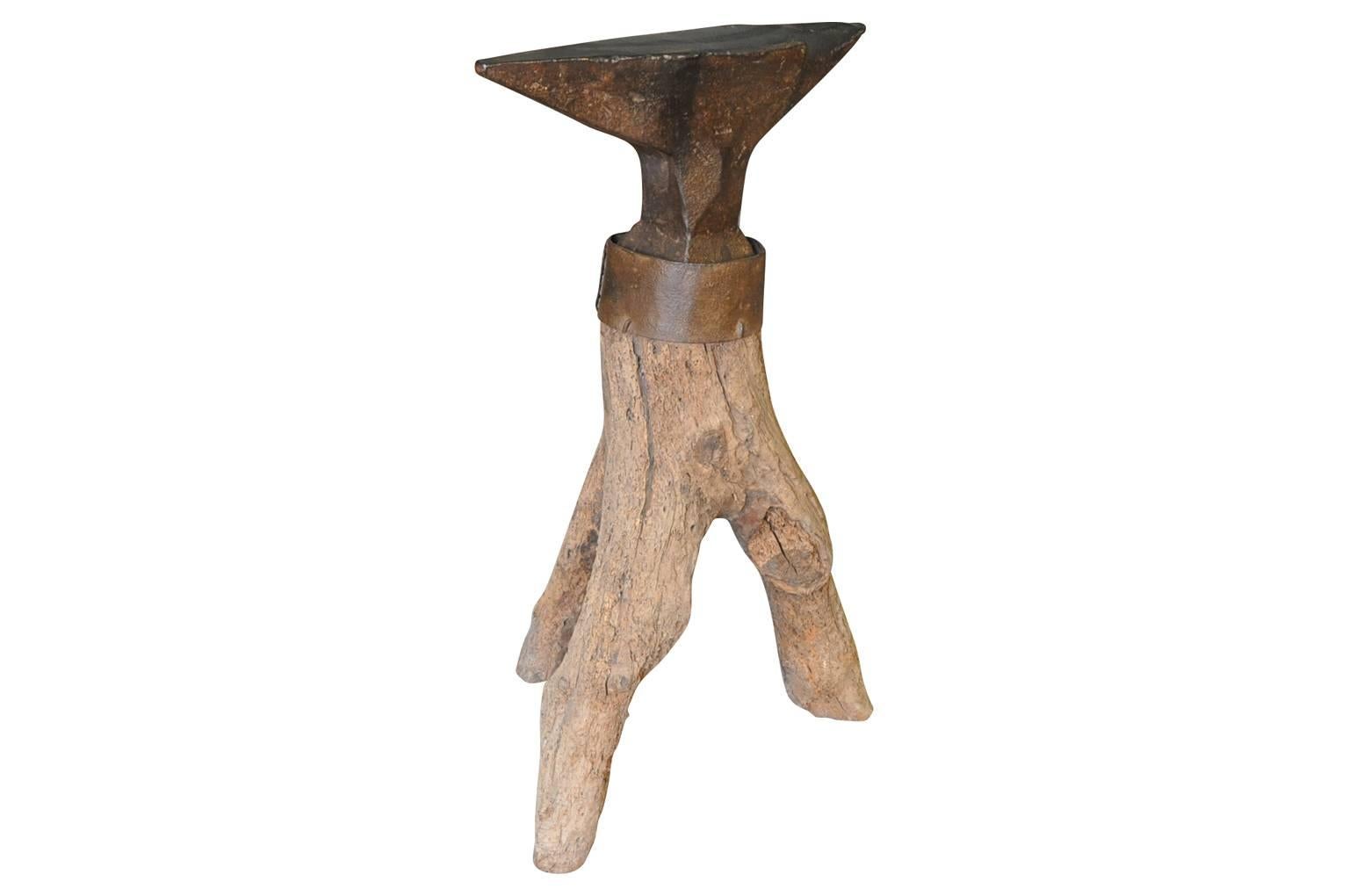 A wonderful 18th century Enclume - Anvil from the South of France. Wonderfully presented on its tree branch base. A terrific sculptural piece.