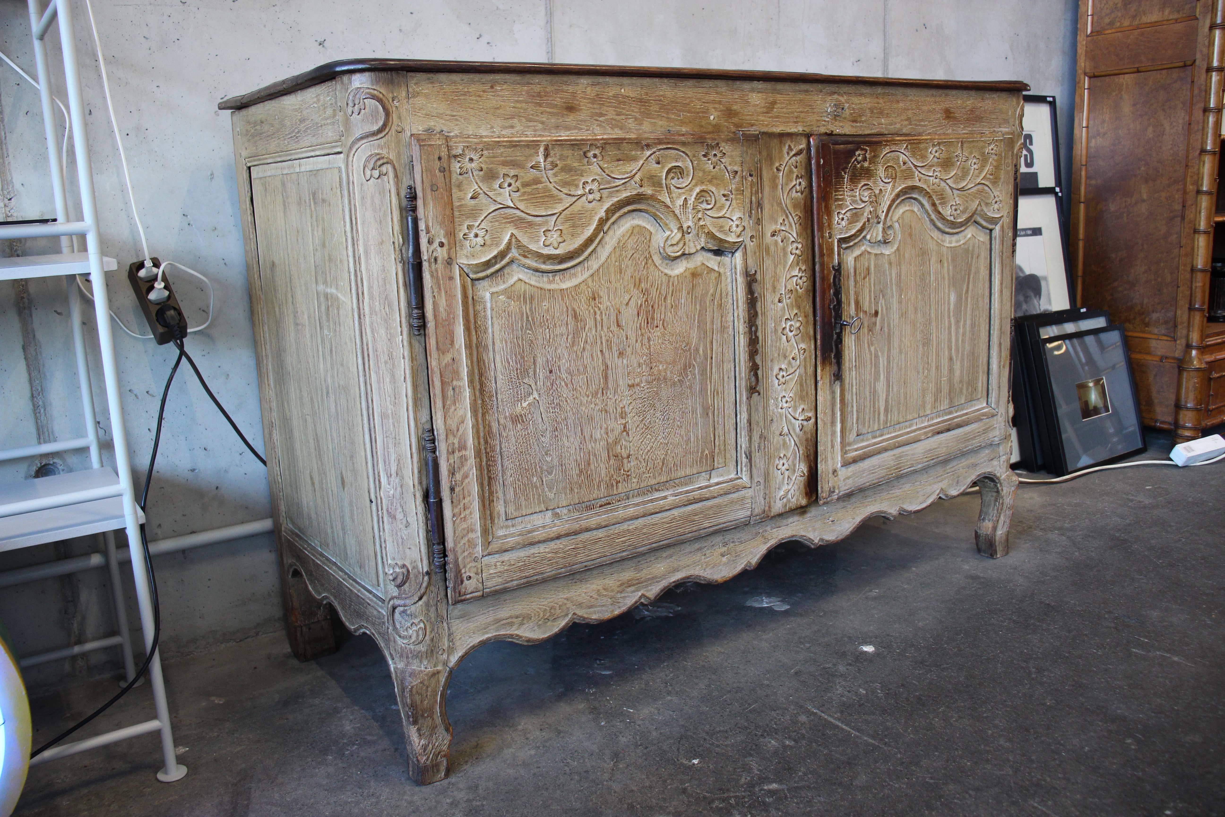 French 18th century baroque commode, European wooden buffet with floral ornament. This 18th century baroque dresser origins from France and is a wonderful antique piece of furniture. The painting is in original condition.