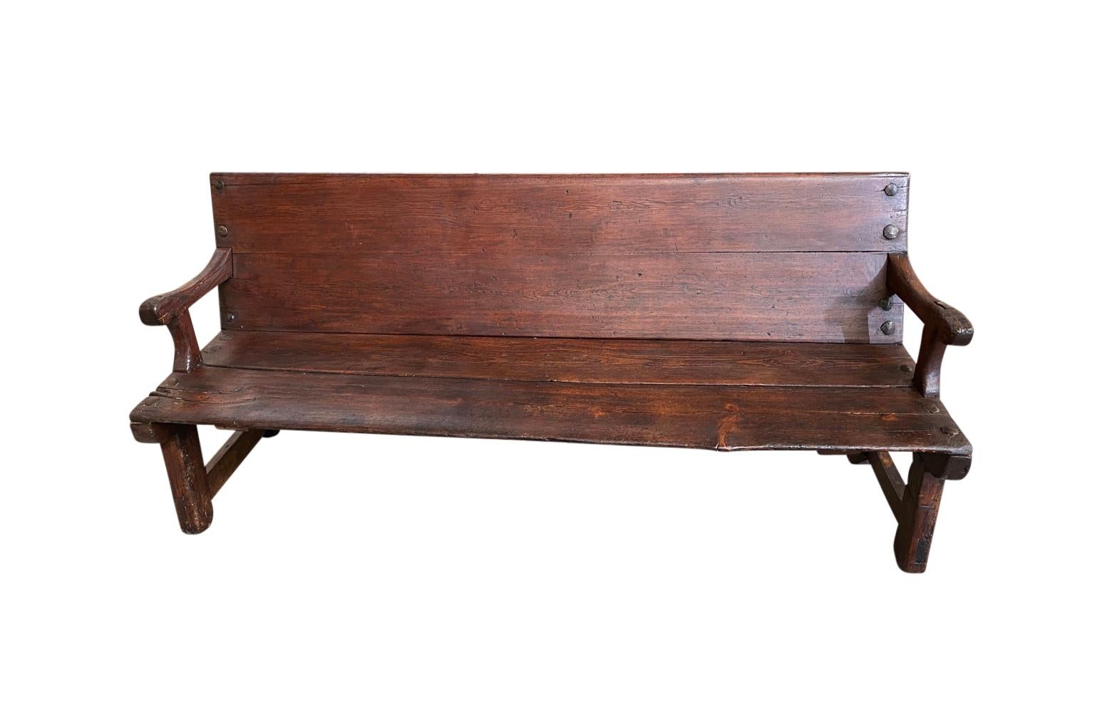 A lovely 18th century bench from the South of France. Soundly constructed from richly stained pine. Beautiful patina.