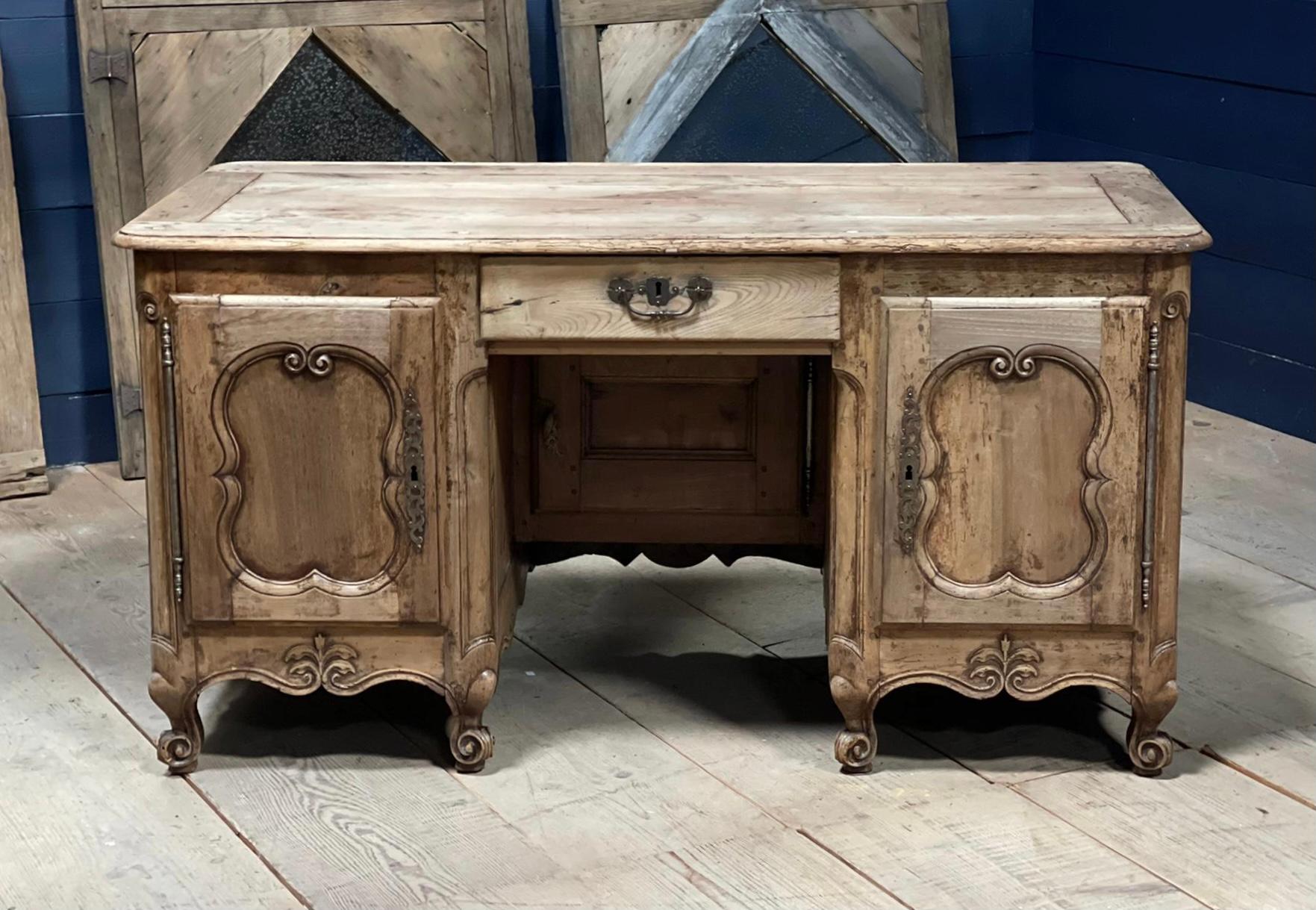A stunning 18th Century Desk. Made from solid Cherry having 2 cupboards and a central drawer, key present. Finished round the back so can be free standing in a room.
Highly decorative, very practical and would look stunning in the right