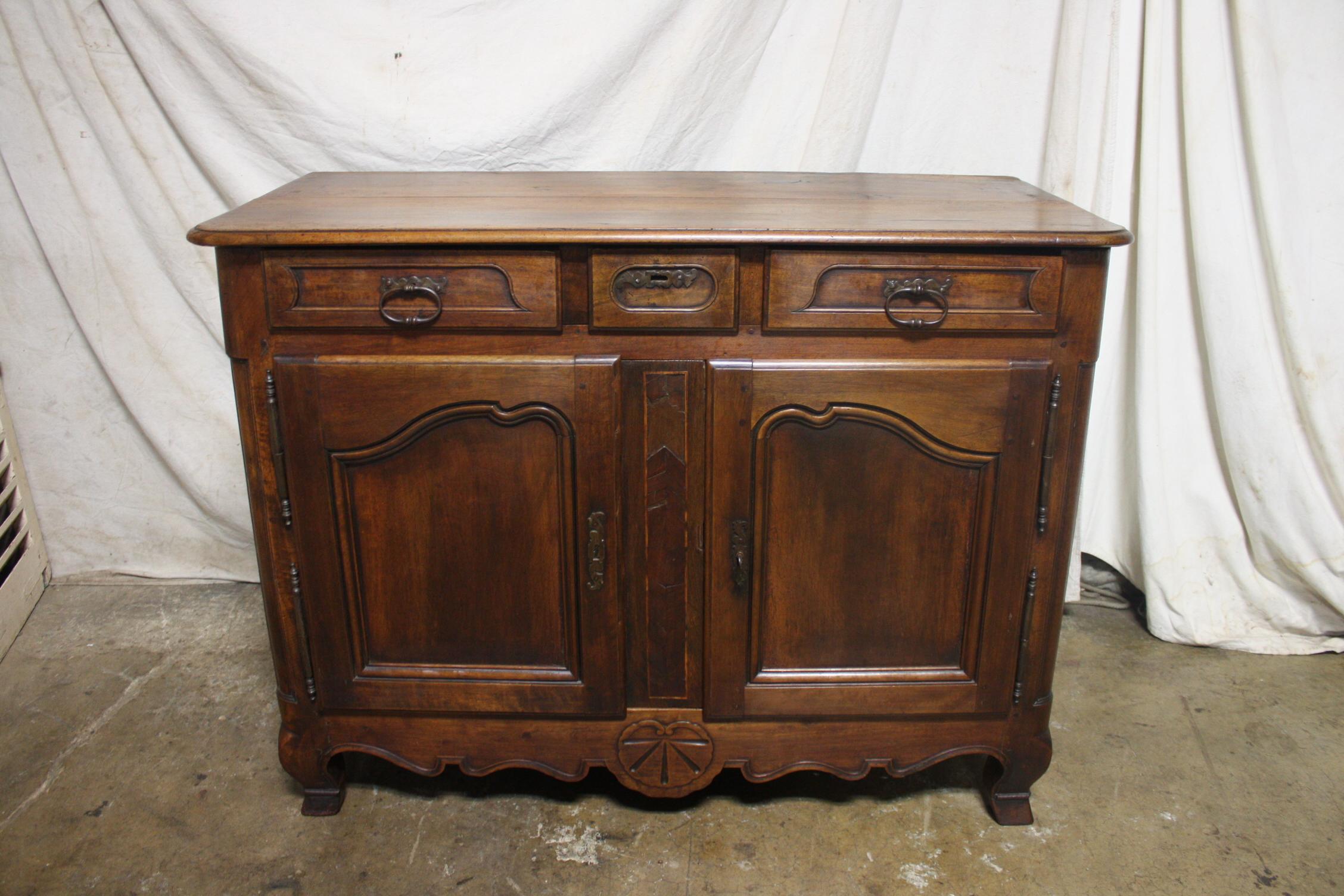 This is a nice rustic buffet in walnut, probably from the county of Bourgogne France.
 