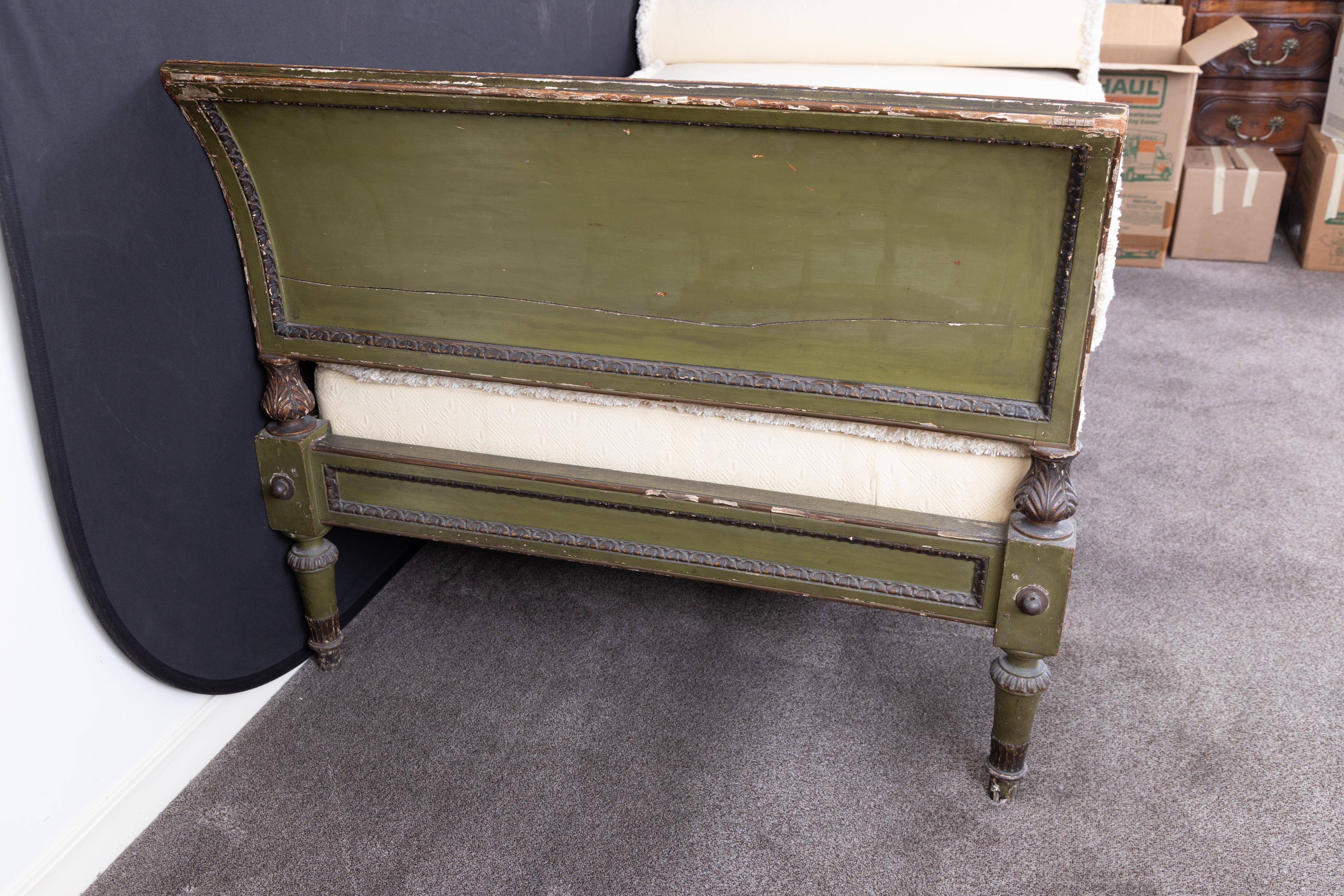 French 18th century carved and painted Louis XVI daybed in the form of a sleigh bed, with a beautiful patina of the classic French green paint. This kind of furniture was used in the eighteenth century, against the wall, with several pillows and