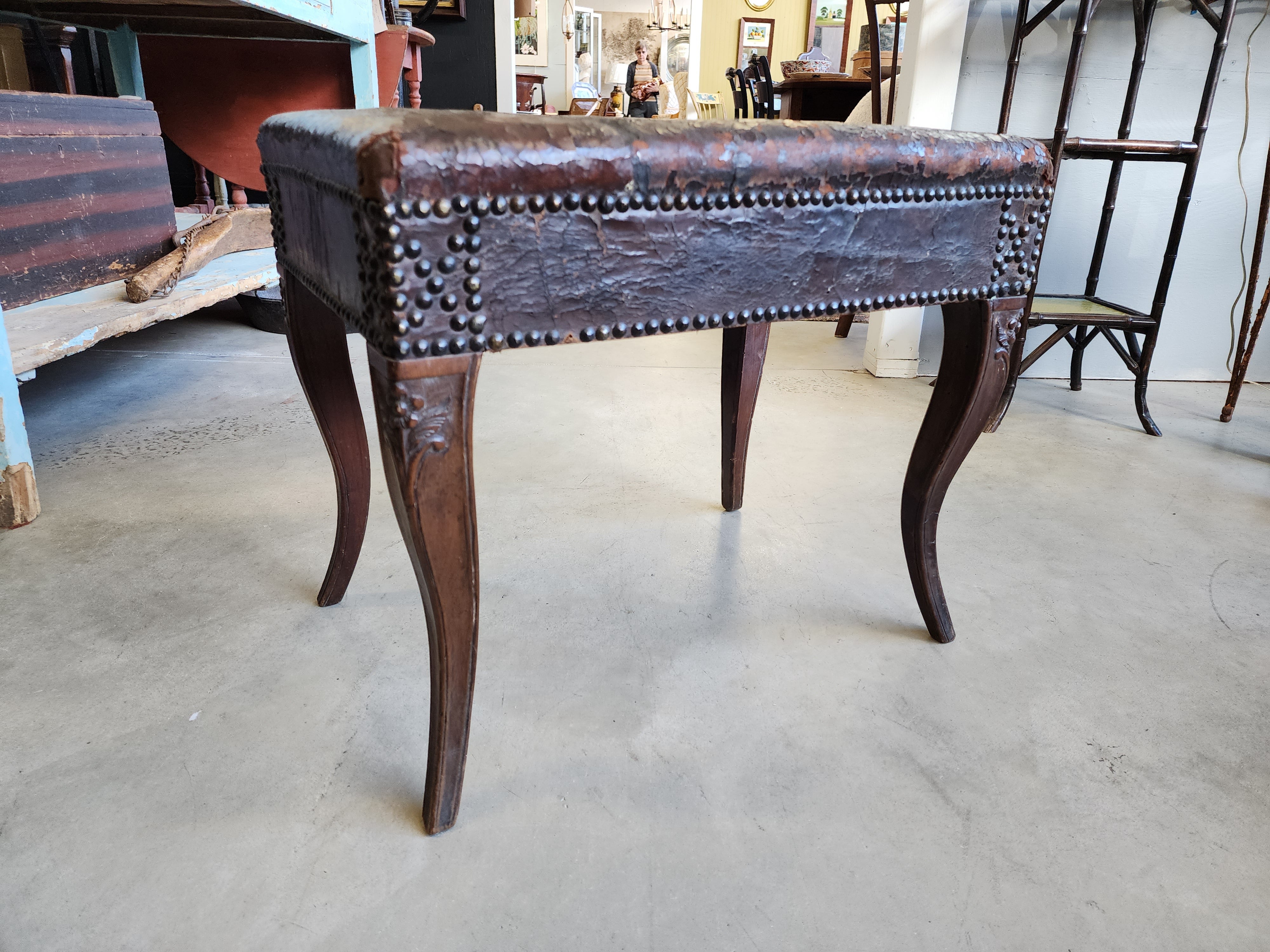 Rare, Louis XV carved walnut bench with original finish and original leather upholstery. Such a wonderful state of preservation, yet strong and ready to be used.
Please contact me with the delivery address for this item to see if I can facilitate a