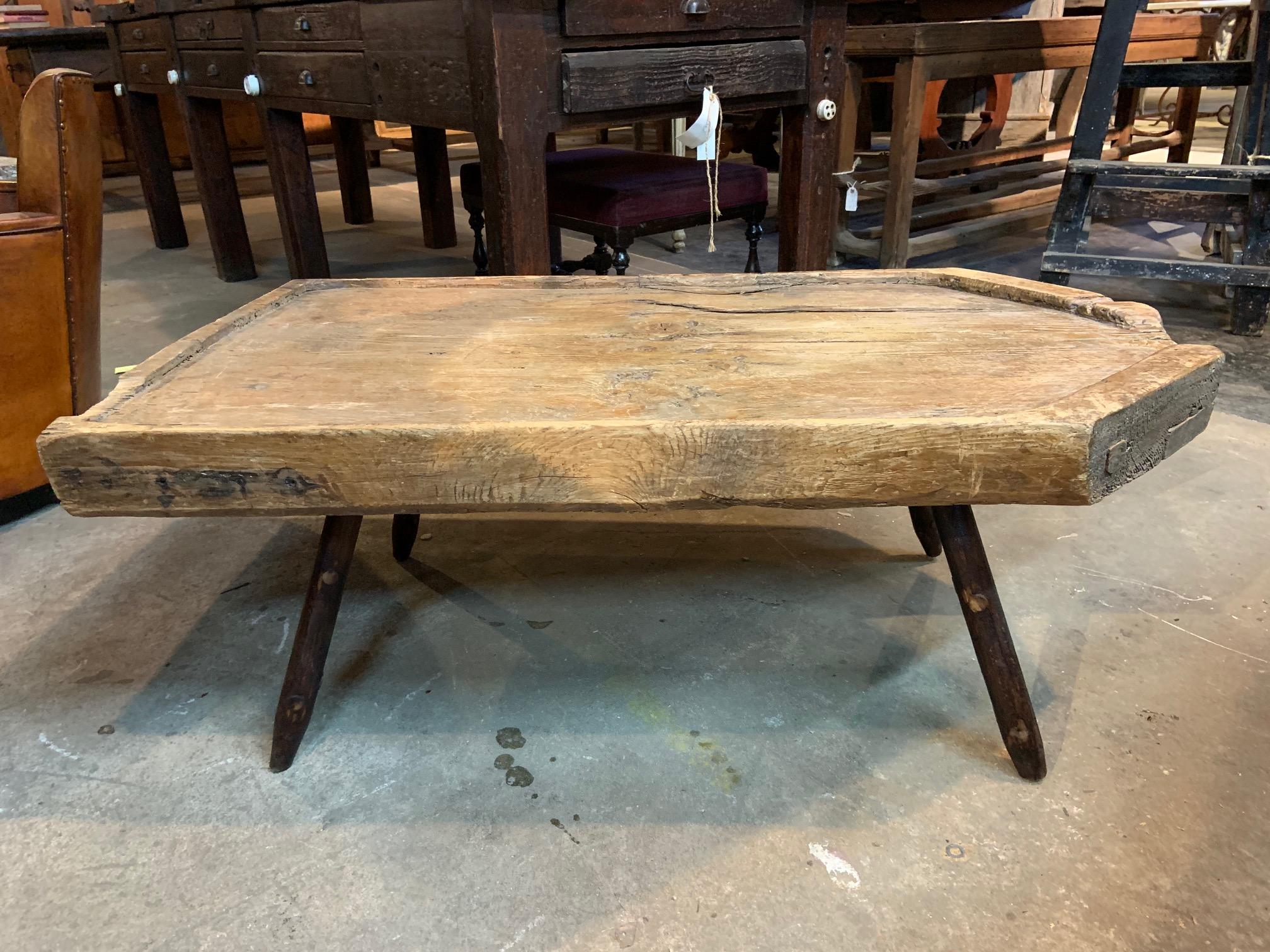 A very attractive 18th century primitive cheese making board, now as a coffee table... Soundly constructed from pine. A terrific cocktail table, coffee table for an indoor or outdoor casual environment.