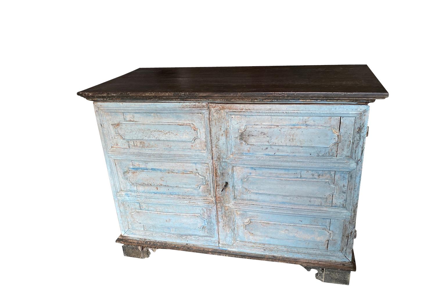 A very elegant mid-18th century Buffet - Commode A Portes from Northern Italy.  Beautifully constructed from painted wood with molded panels to the 2 doors and sides, an interior sliding shelf, raised on bracket feet.  Wonderful finish.  A charming