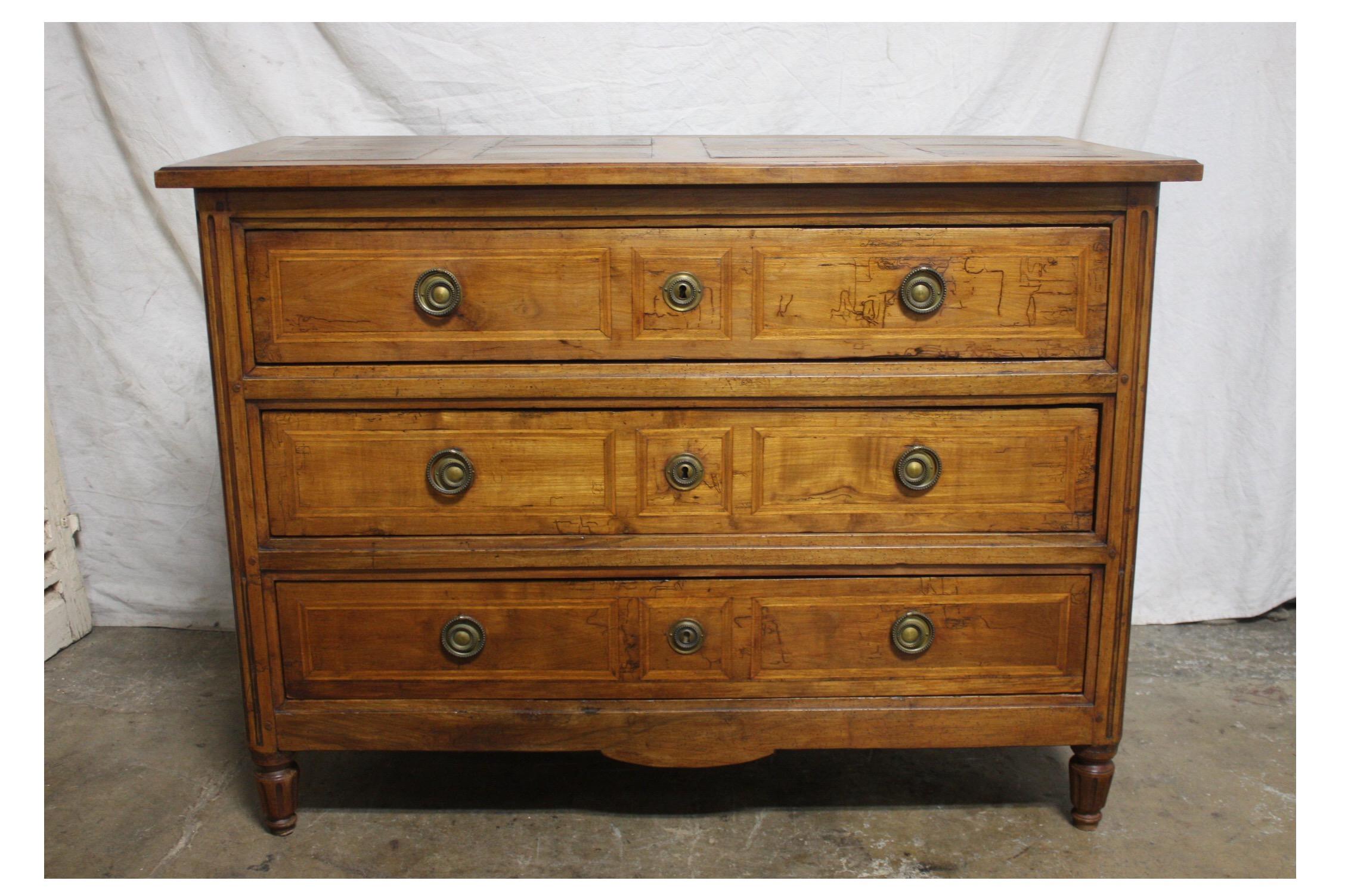 Beautiful French 18th century commode in walnut with a parqueted wood top.