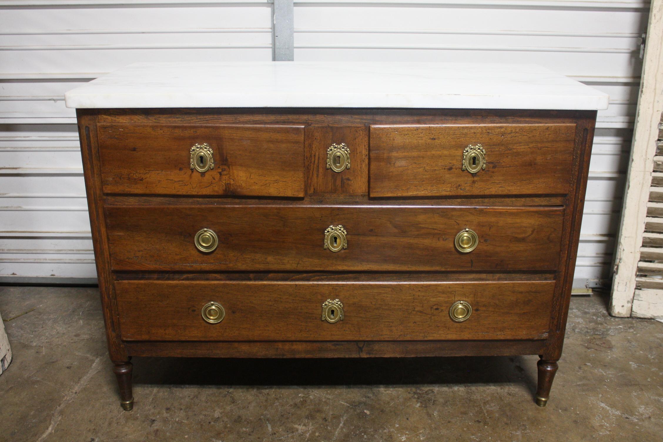 This Louis XVI Period chest is just elegancy and authenticity. Nice contrast between the white marble and the walnut wood. Just beautiful to look at it.