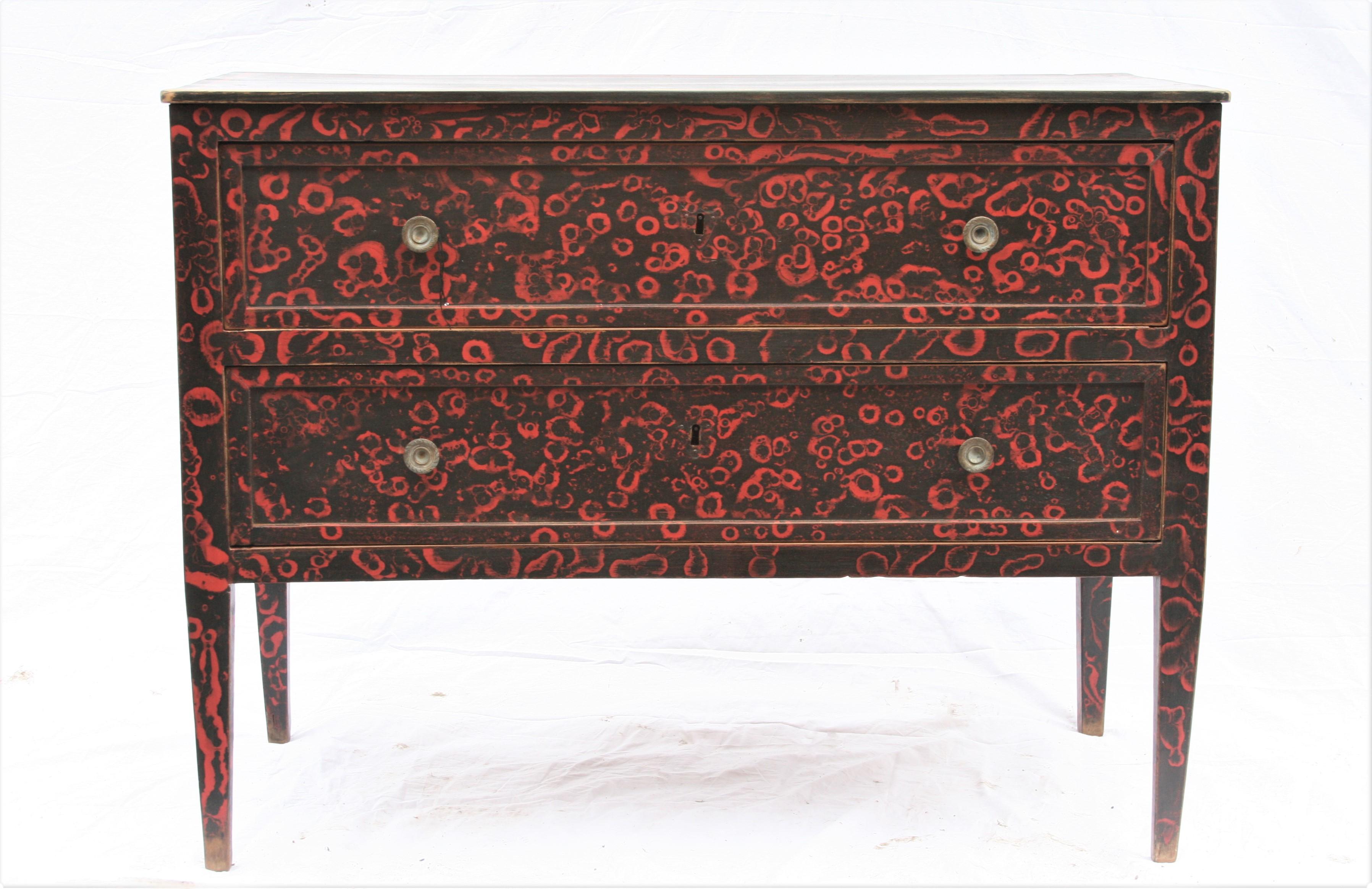 Good elegant model of period commode in red and black paint finish, two drawers and brass handles.