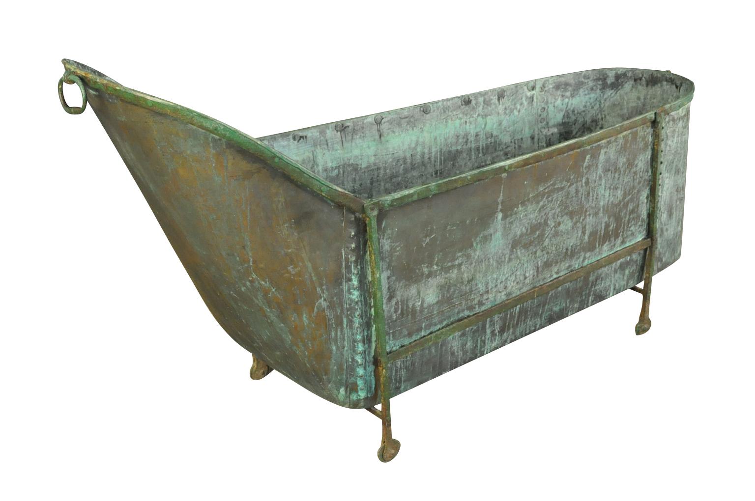 A sensational 18th century bathtub from the South of France. Expertly crafted from very heavy gauge cooper housed in its iron frame. Super patina.