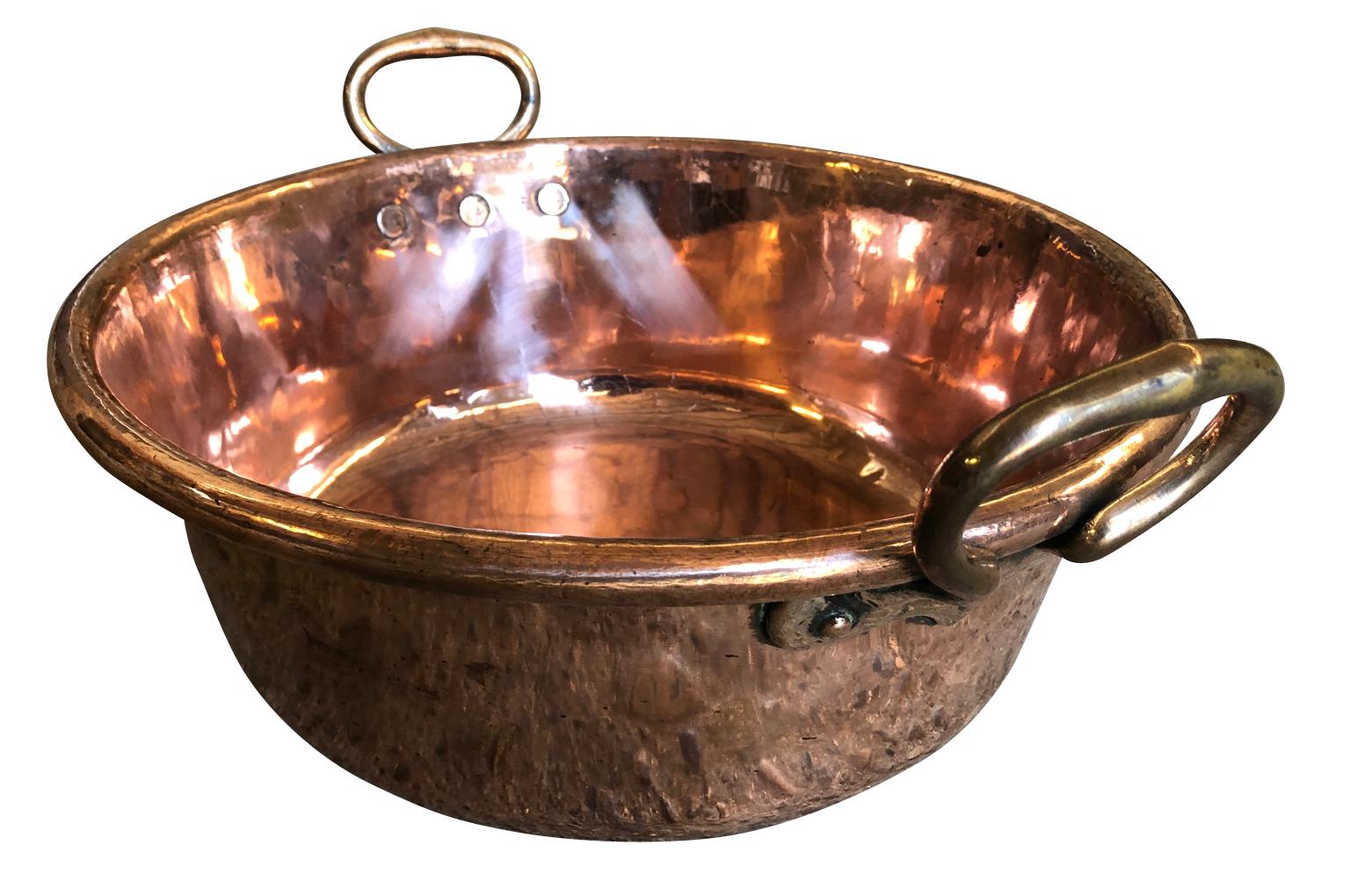 A lovely 18th century copper pan from the South of France. A wonderful accent piece for any kitchen or living area.