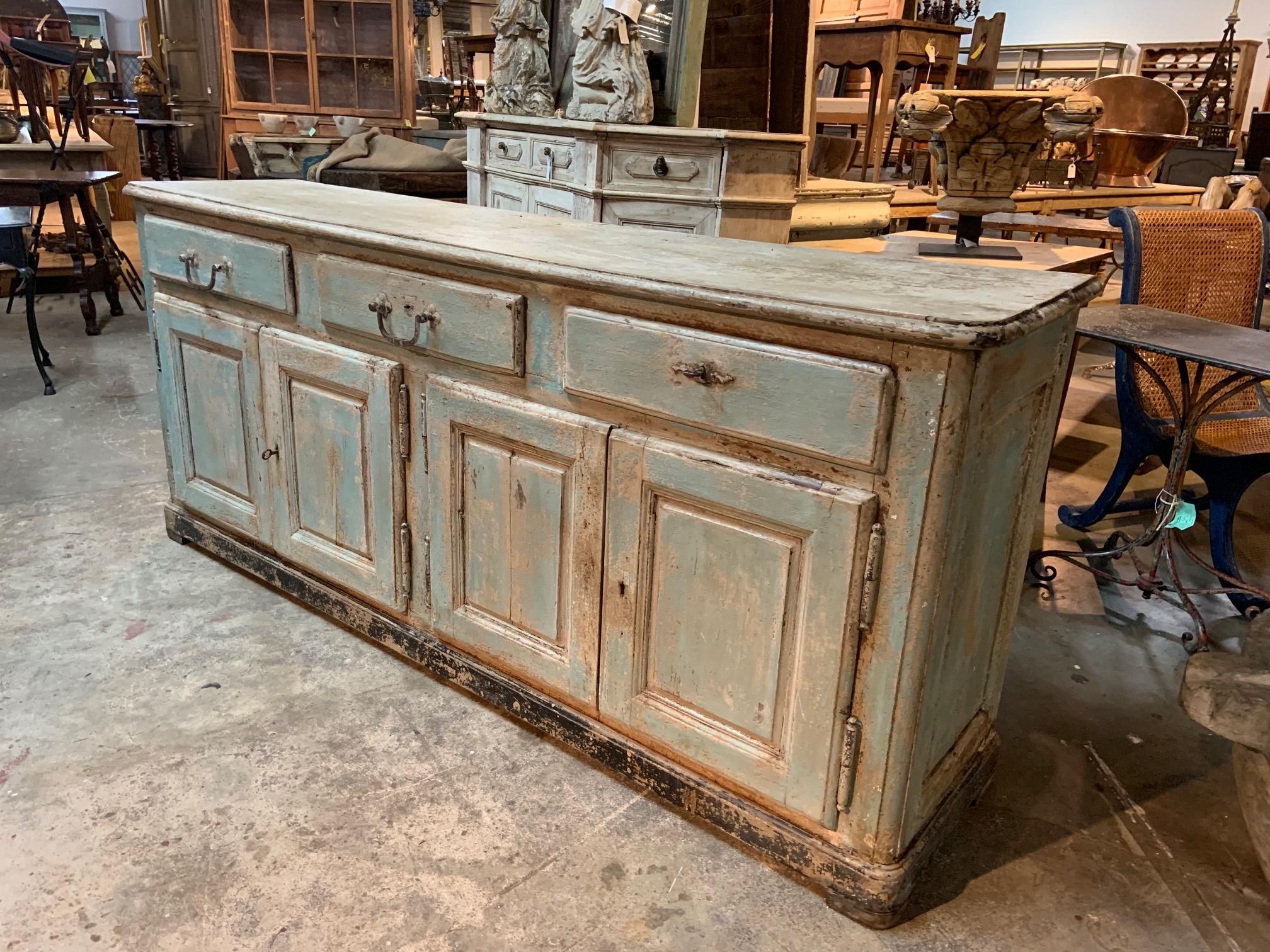 A very handsome Enfilade - buffet from the Provenance region of France. Wonderfully constructed from painted wood. A terrific storage piece with four doors and three drawers. Great patina.